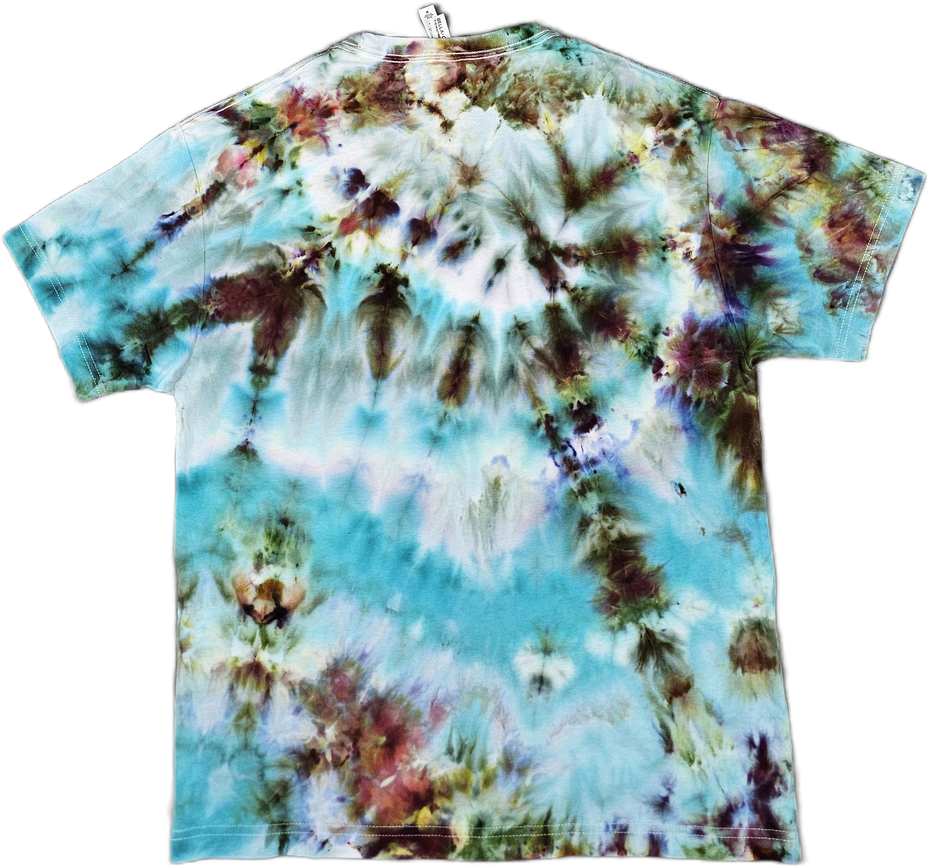 Back of a Bella + Canvas  tie-dye T-shirt with a multicolor pattern of blues, browns, reds, and greens.