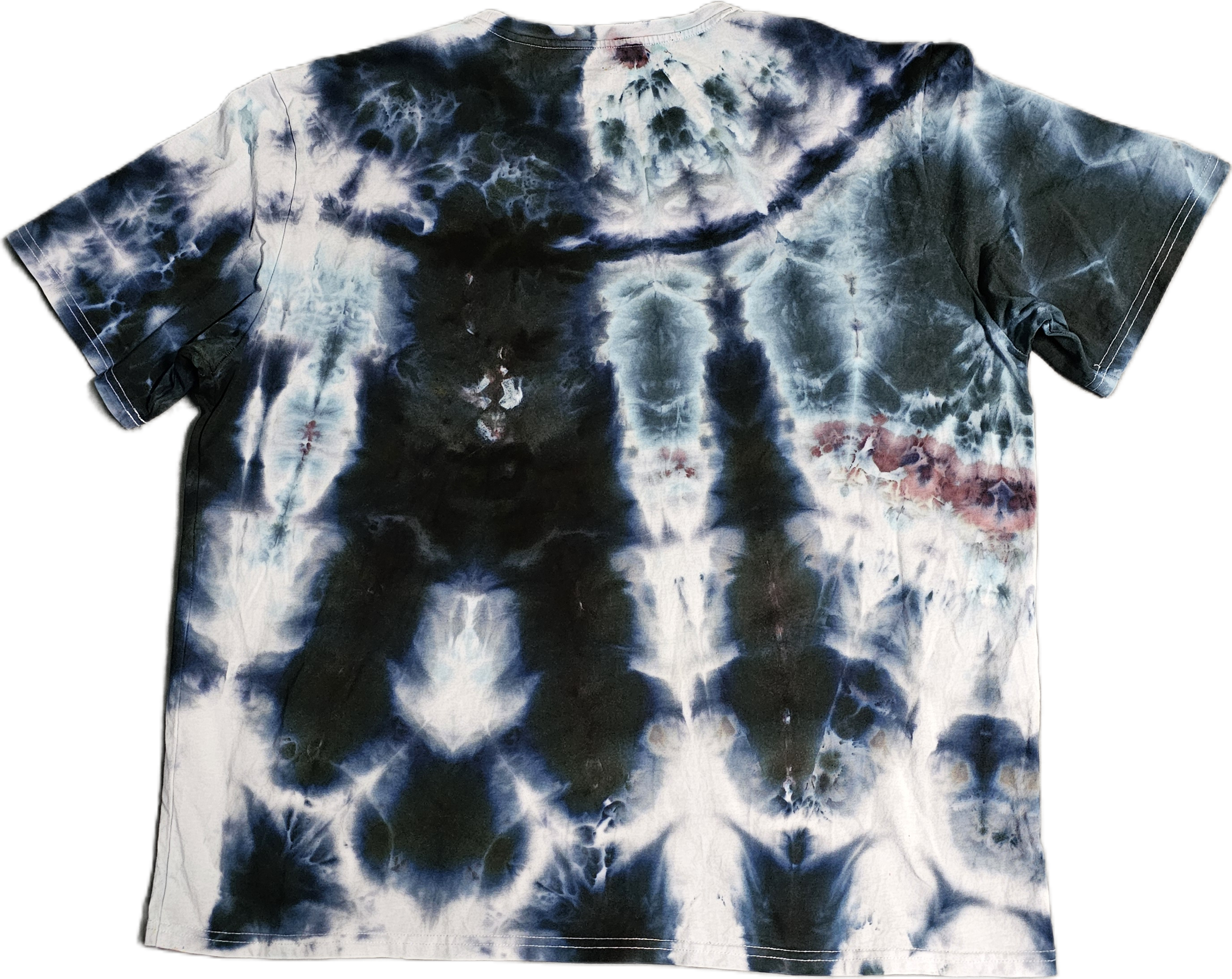 A tie-dye T-shirt with a dark blue, black, and white pattern, including some reddish stains.