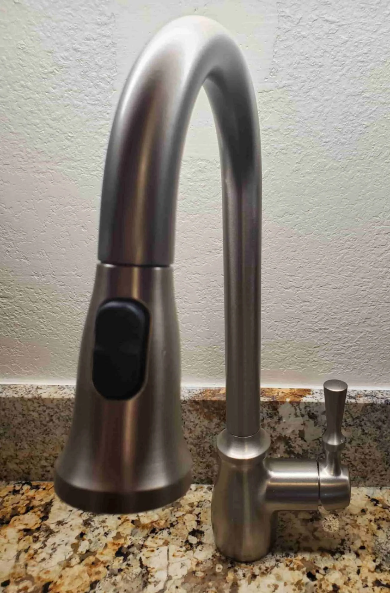 installation of sink, granite countertop and stainless-steel kitchen faucet