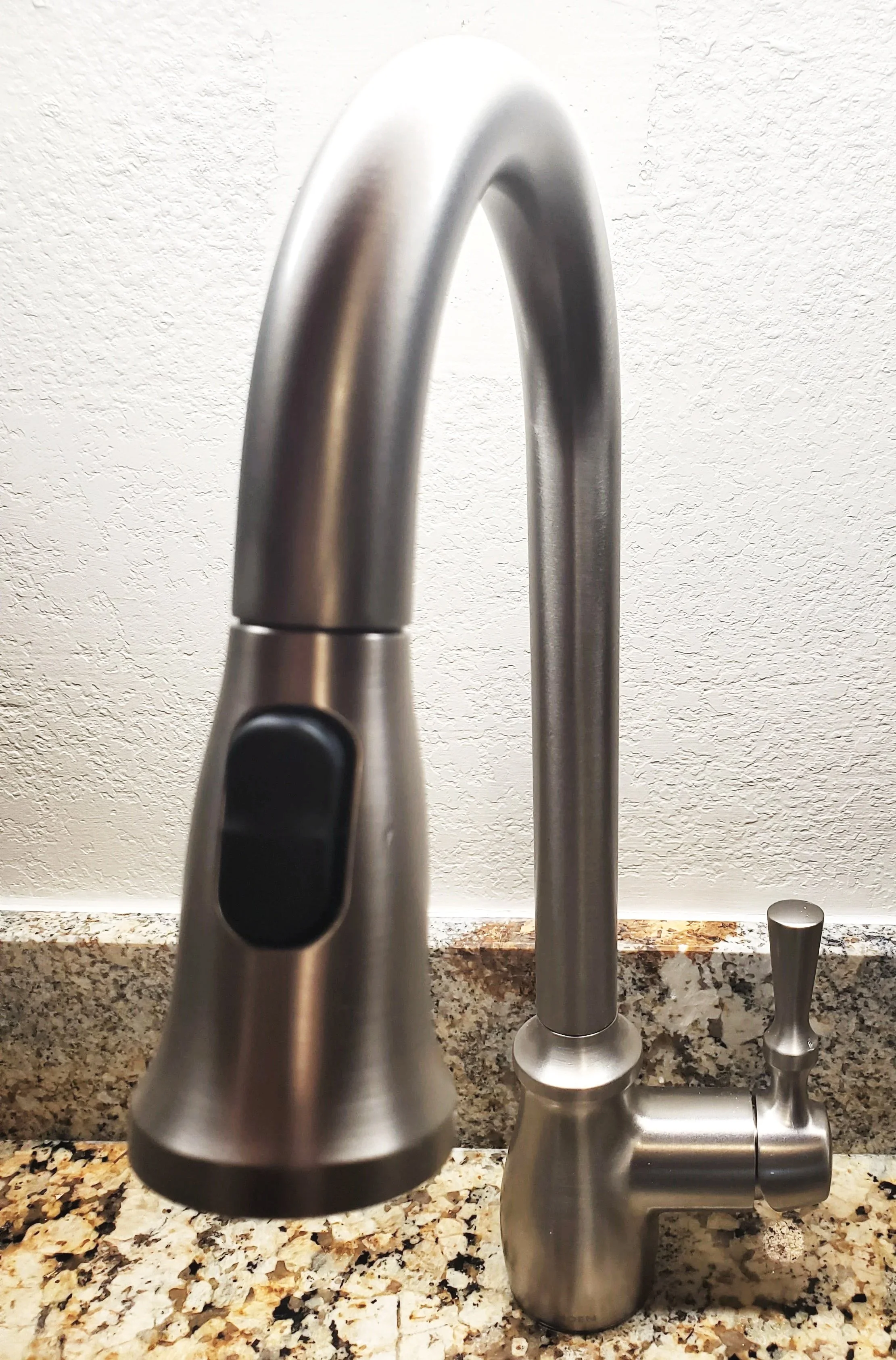 installation of sink, granite countertop and stainless-steel kitchen faucet