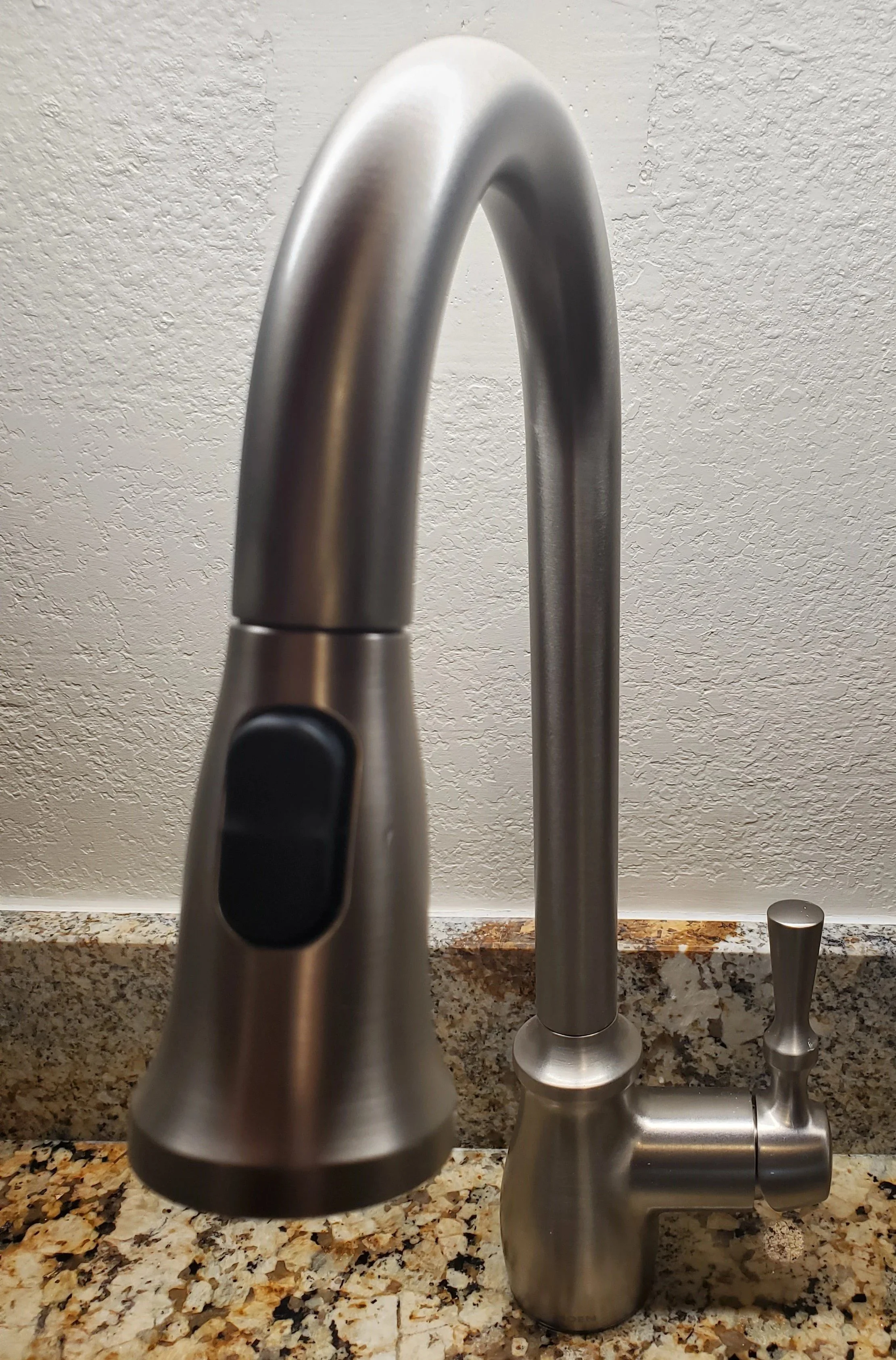 installation of sink, granite countertop and stainless-steel kitchen faucet