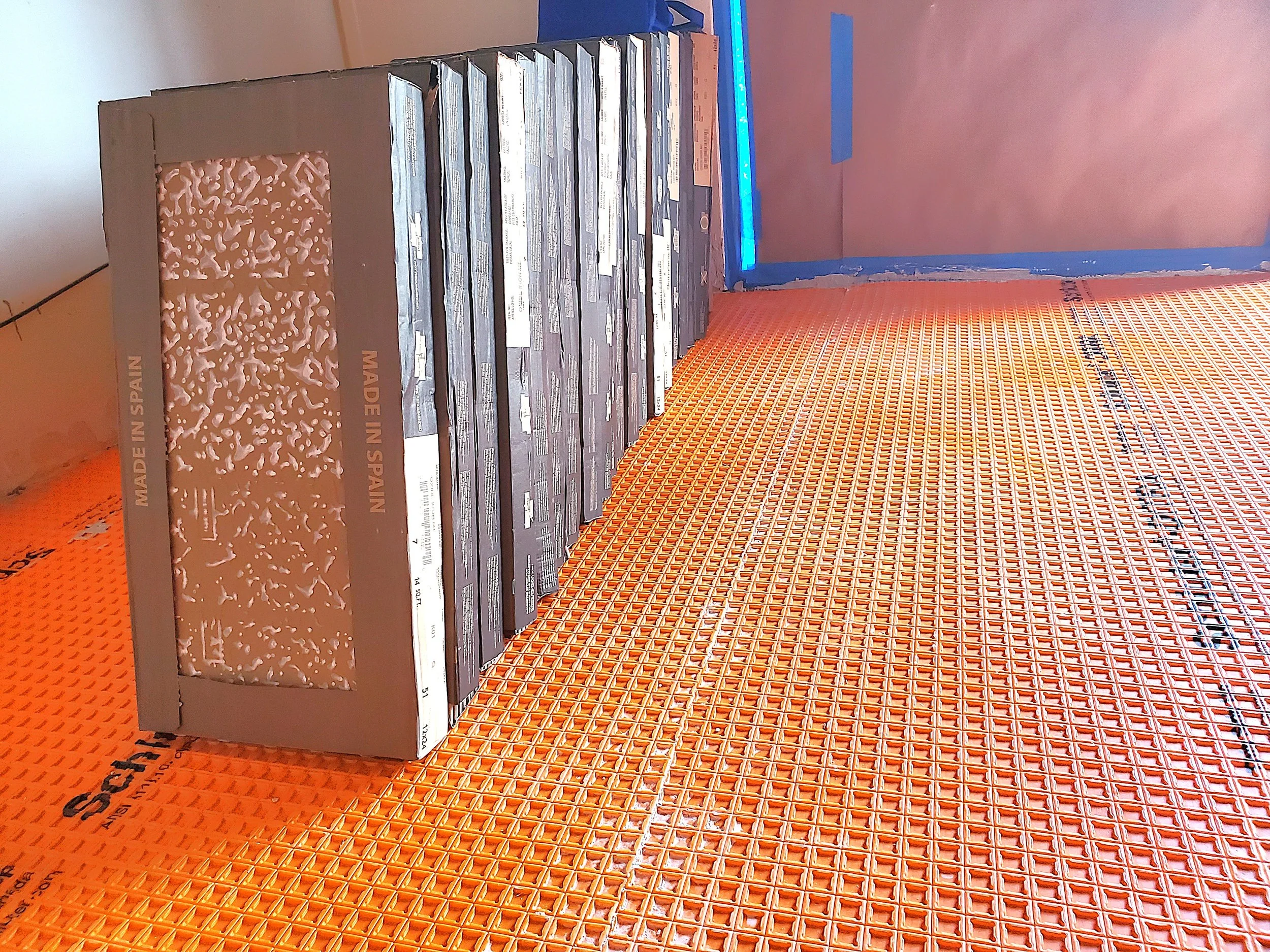 Tile floor prep using thick insulation material over concrete floor