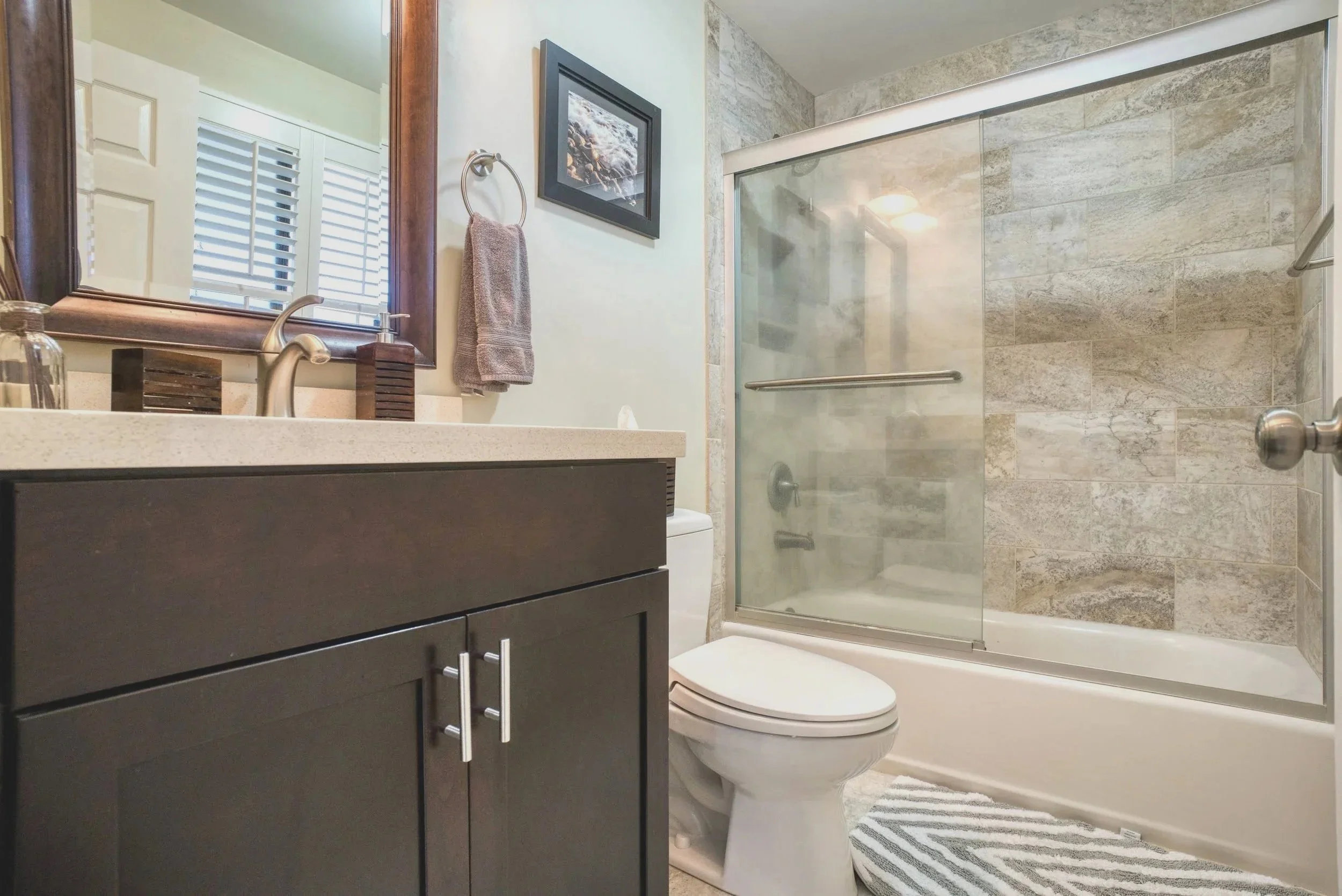 modern bathroom remodel and install of vanity cabinet, shower tile surround and glass doors, hang mirrors and accessories and bathroom fixtures, plumbing