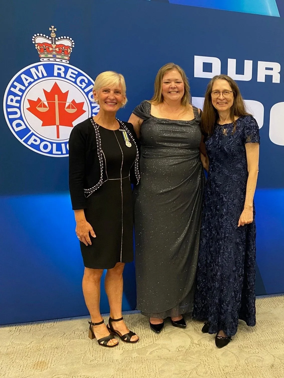 Retired Detective Nancy van Rooy celebrating the 50th Anniversary of Durham Regional Police with community members.