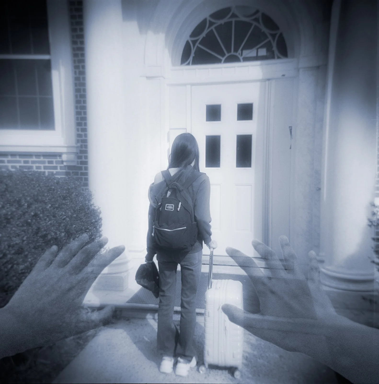 Left Behind, 19.5x19.7, 2025. Holga film captures sister leaving for college. Leaving me alone to fend for myself. I reach out to stop her, but it feels as though it's a dream, and I have no control. She leaves.