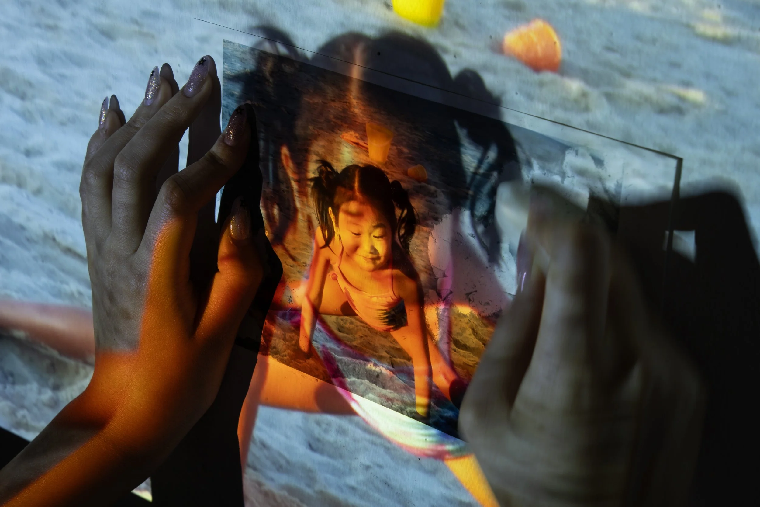 Traces of Light, 25x16.6, 2024. Digital camera captures image projected onto itself. Light meets paper. Mom doesn't want me to do ballet, so I try to erase my childhood love for it. Why won't it go away? 
