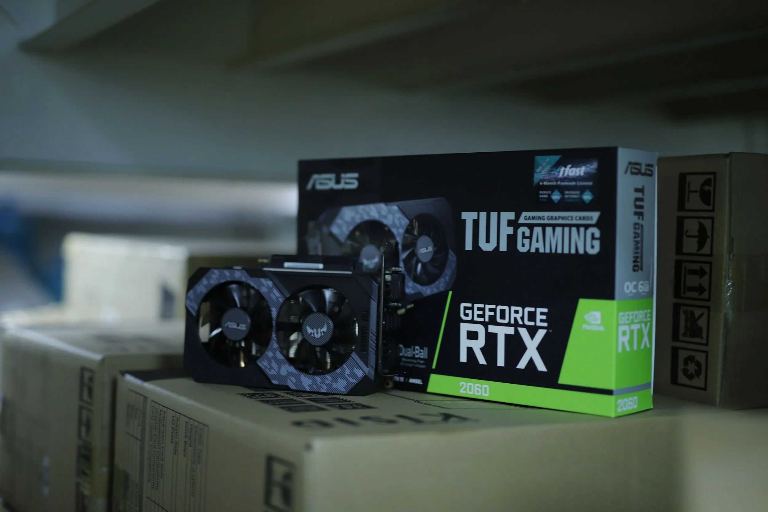 A box of graphics cards on a store shelf.