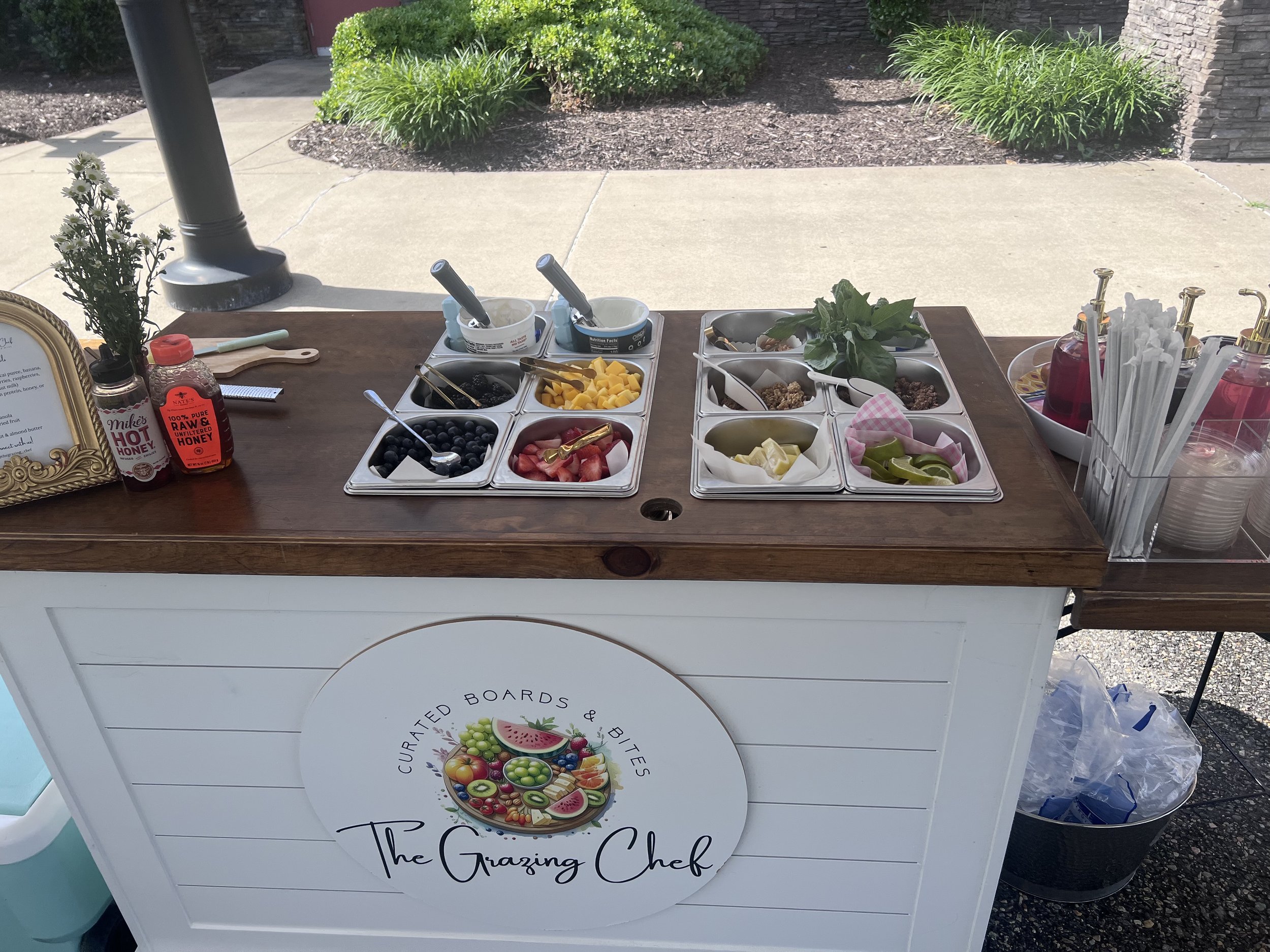A yogurt parfait & acai bowl cart set up for a private event.