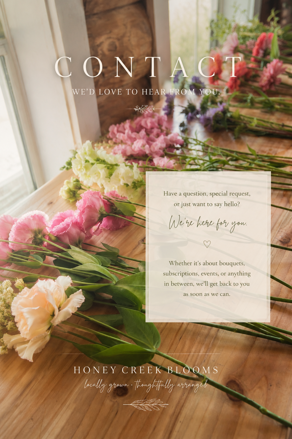 A contact page for Honey Creek Blooms featuring a wooden table with various colorful bouquets of flowers, including pink, white, purple, yellow, and peach, arranged on it. There is a transparent overlay with text inviting customers to reach out for questions or special requests.