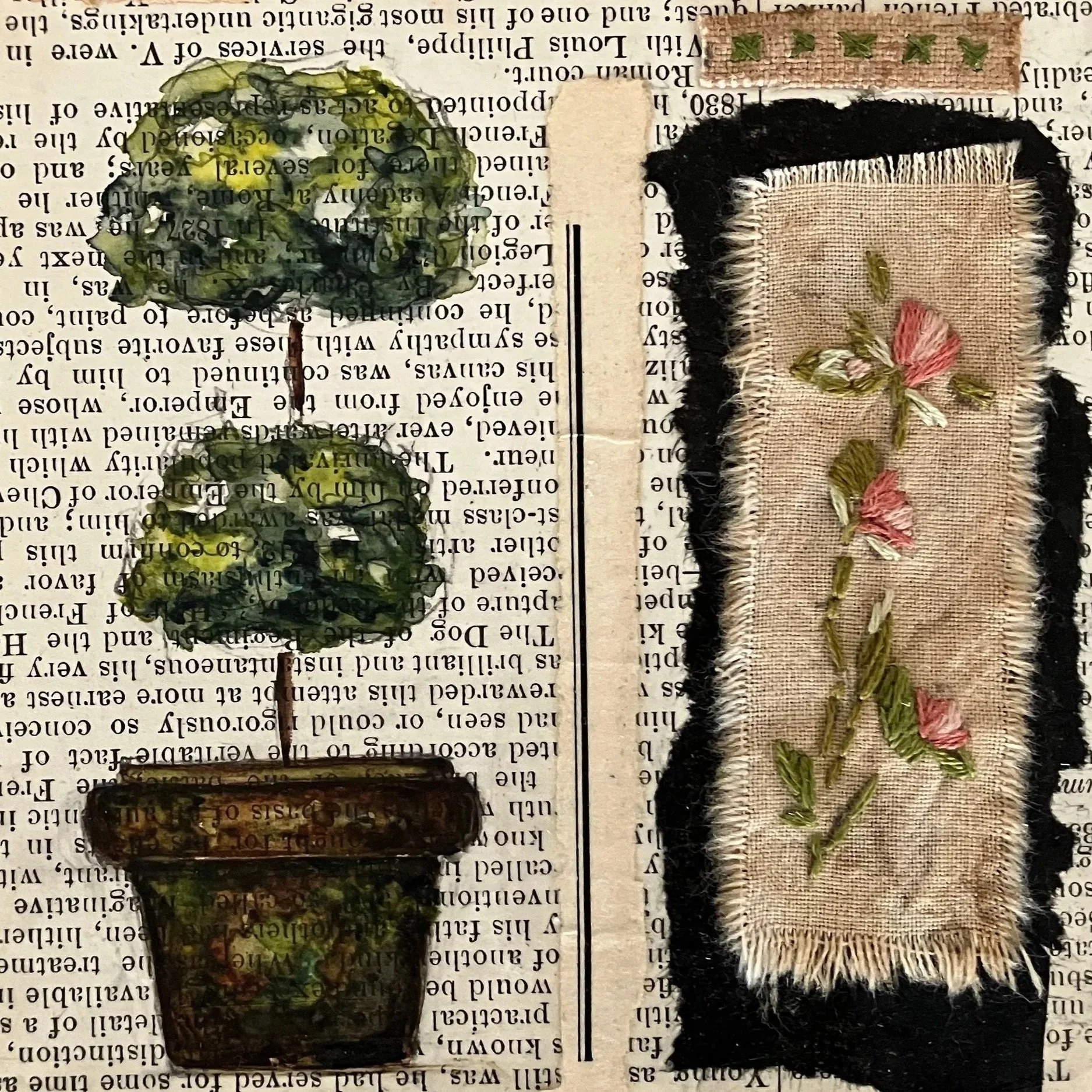 The image shows two handmade fabric patches with floral embroidery placed on top of printed text. The fabric patches have frayed edges and are decorated with small flower designs in pink and green. The patches are rectangular, with one being smaller and darker, and the other larger with a more beige tone. They are positioned on an open book or newspaper, with visible text underneath.
