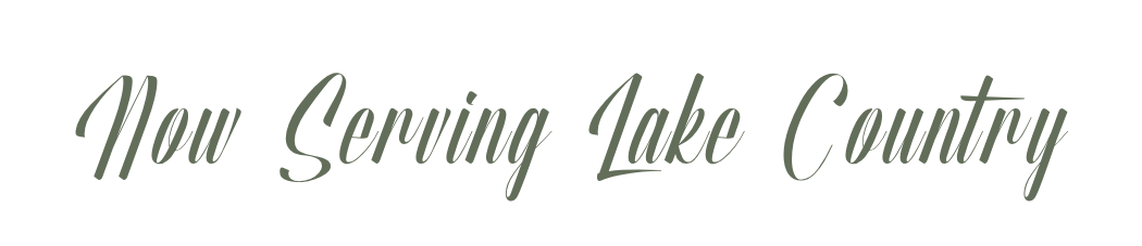 Text reading 'Now Serving Lake County' in elegant green cursive font on a white background.