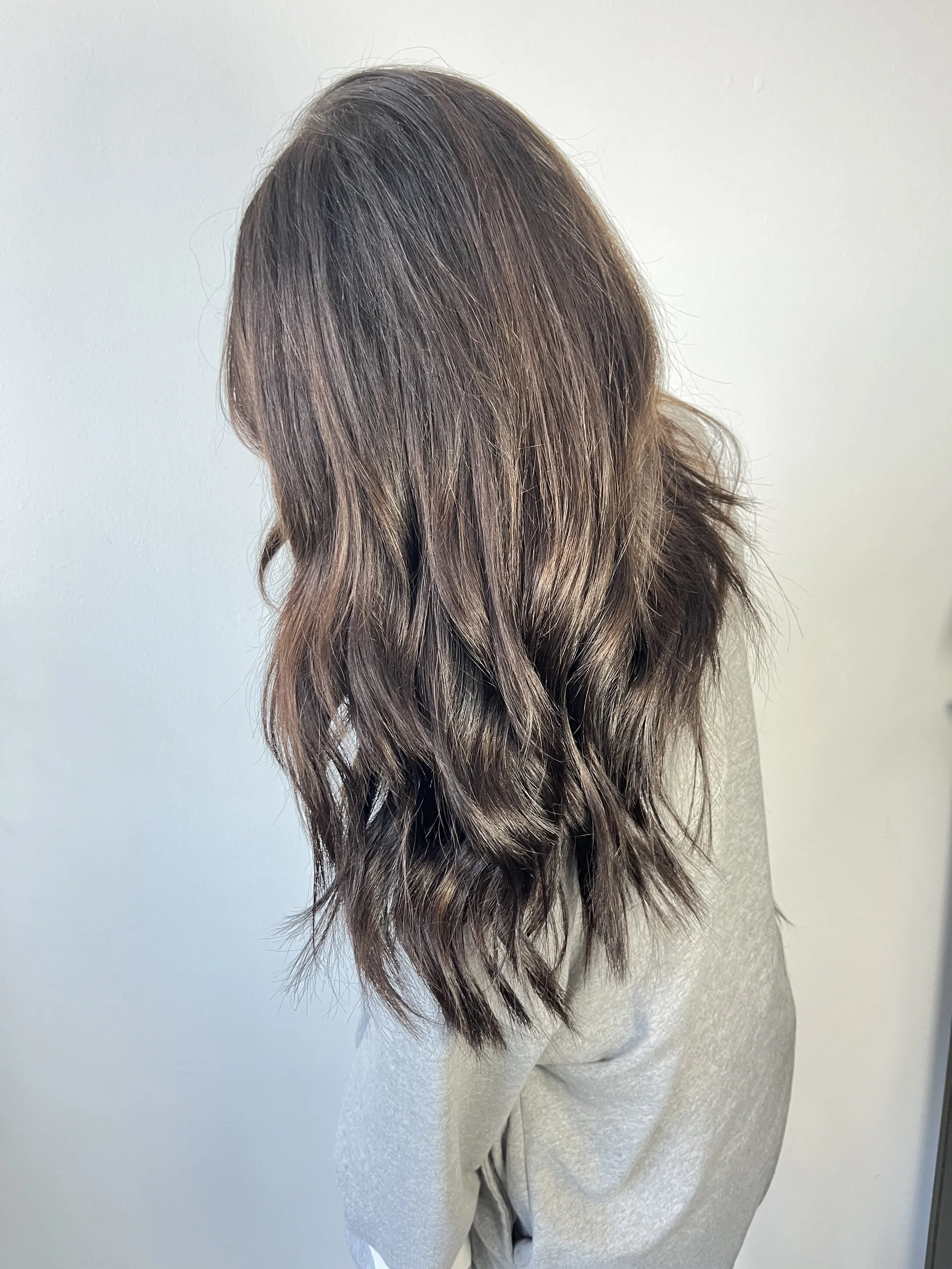 Beautiful chocolate brown with caramel highlights ribbon through 18 inch hair extensions to add density and a fuller ponytail.