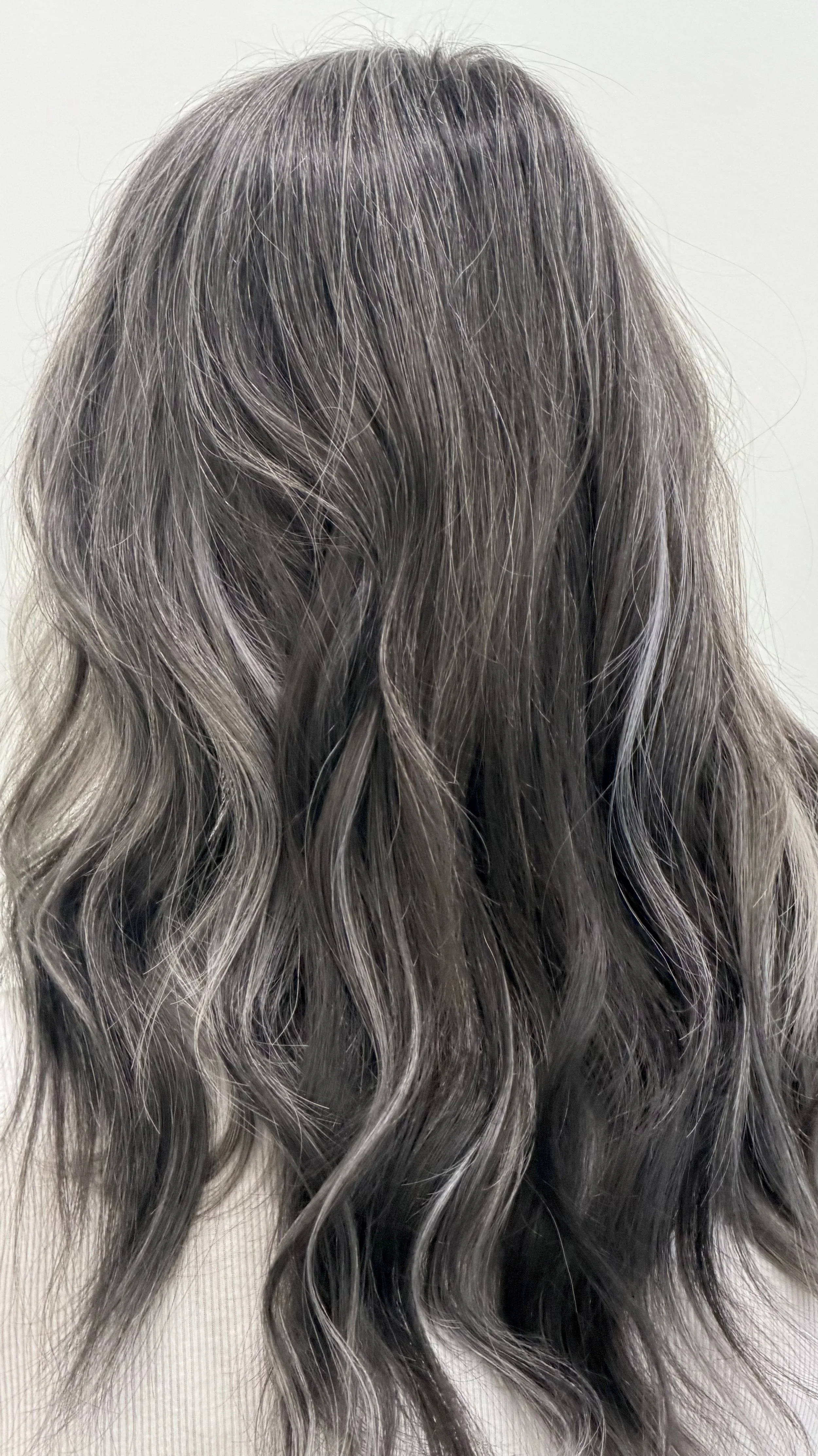 Custom color hair extensions to complement Hurt, natural salt and pepper hair
