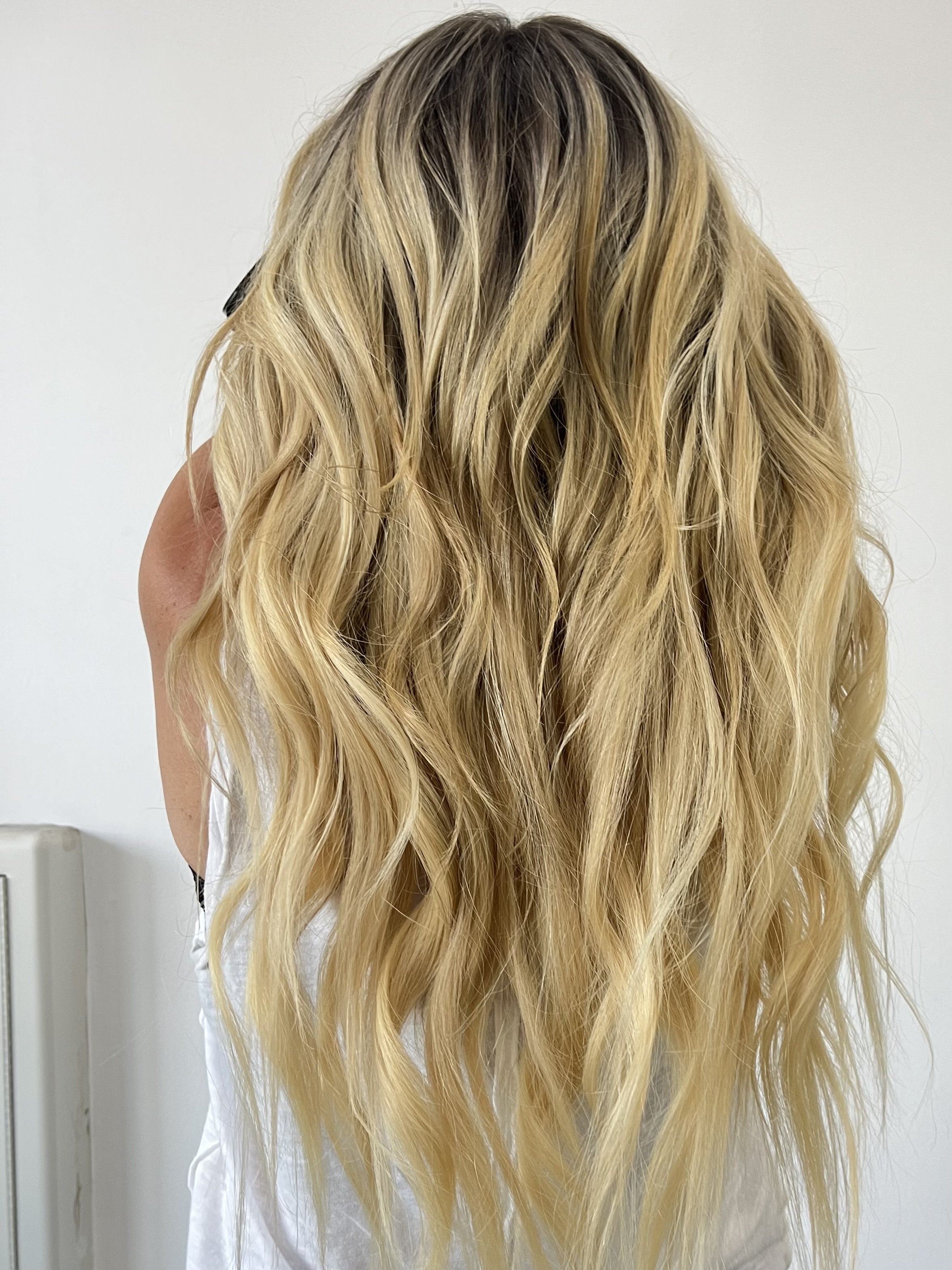 Custom colored dimensional blonde. 22 inch hair extensions added.