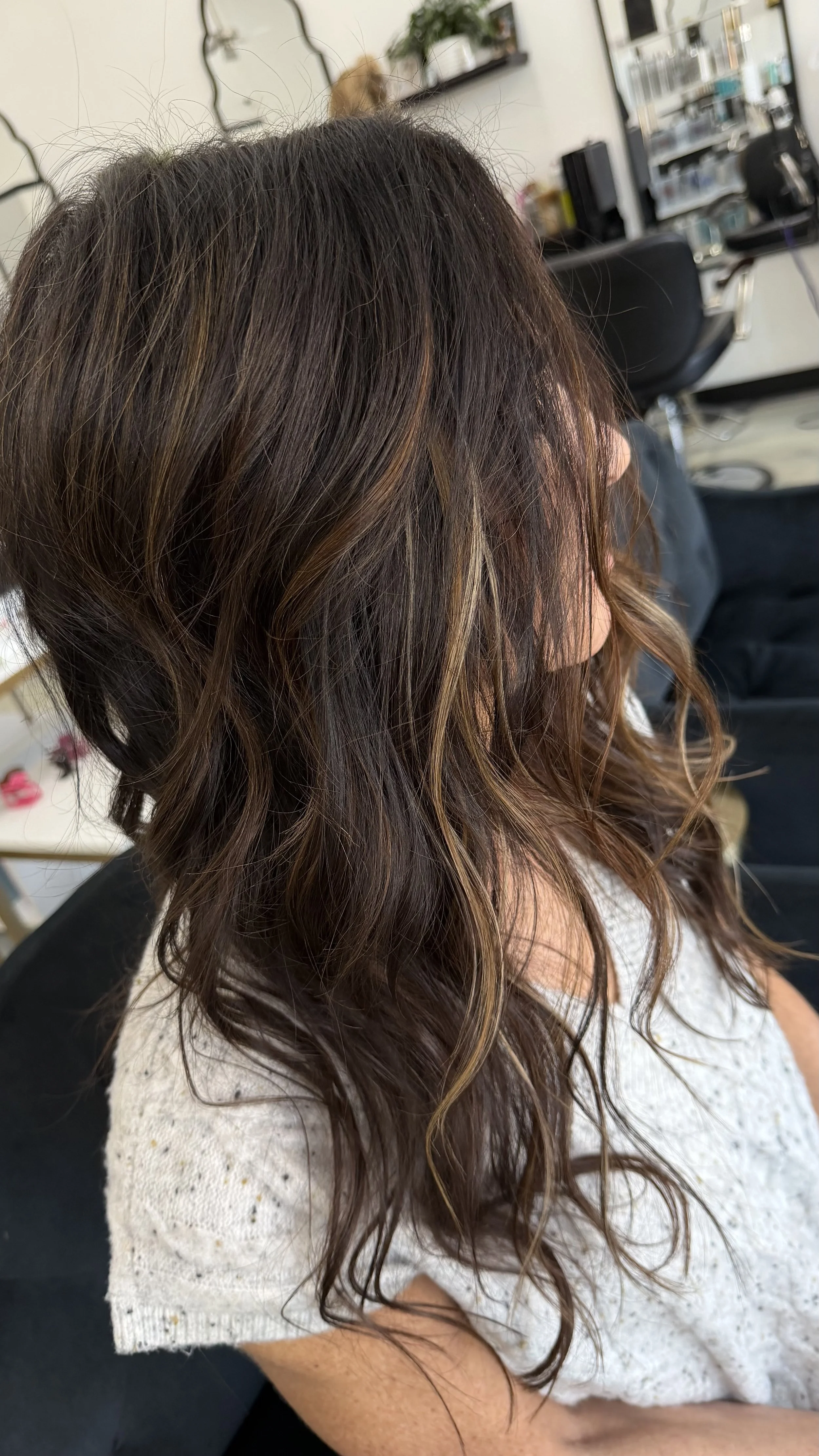 Ktips we're added to fill in her sparse sides. She was craving density and fullness along with some blonde highlights to complement around her face.