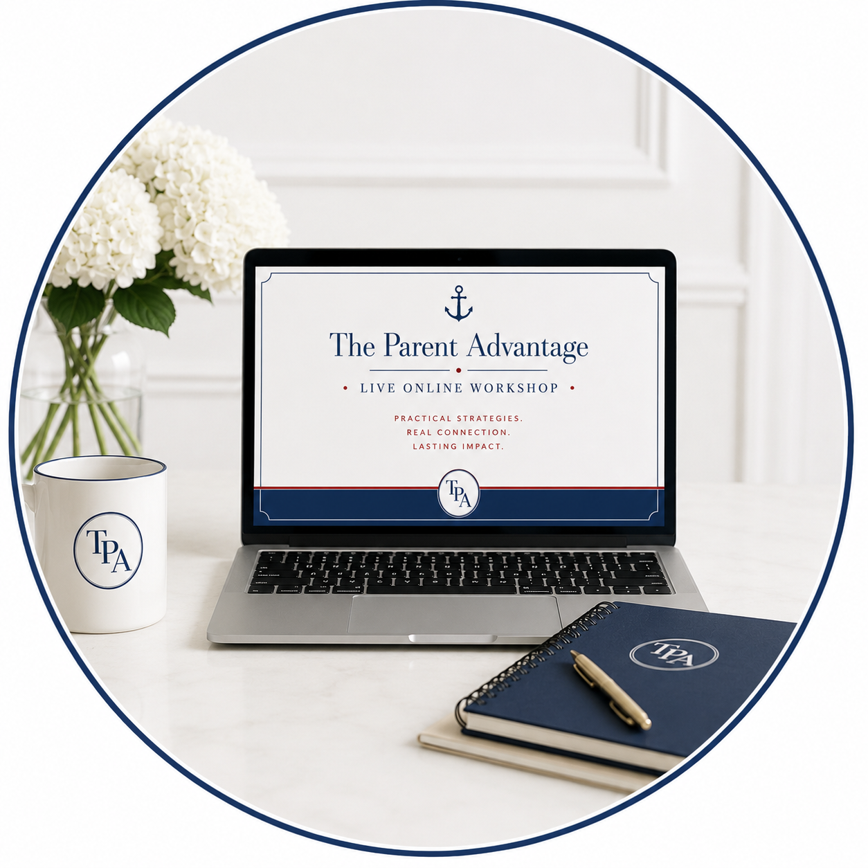 Laptop displaying 'The Parent Advantage' online workshop, white mug with initials 'TPA', blue notebook with 'TPA' logo and pen, white flowers in a glass vase on a white table.