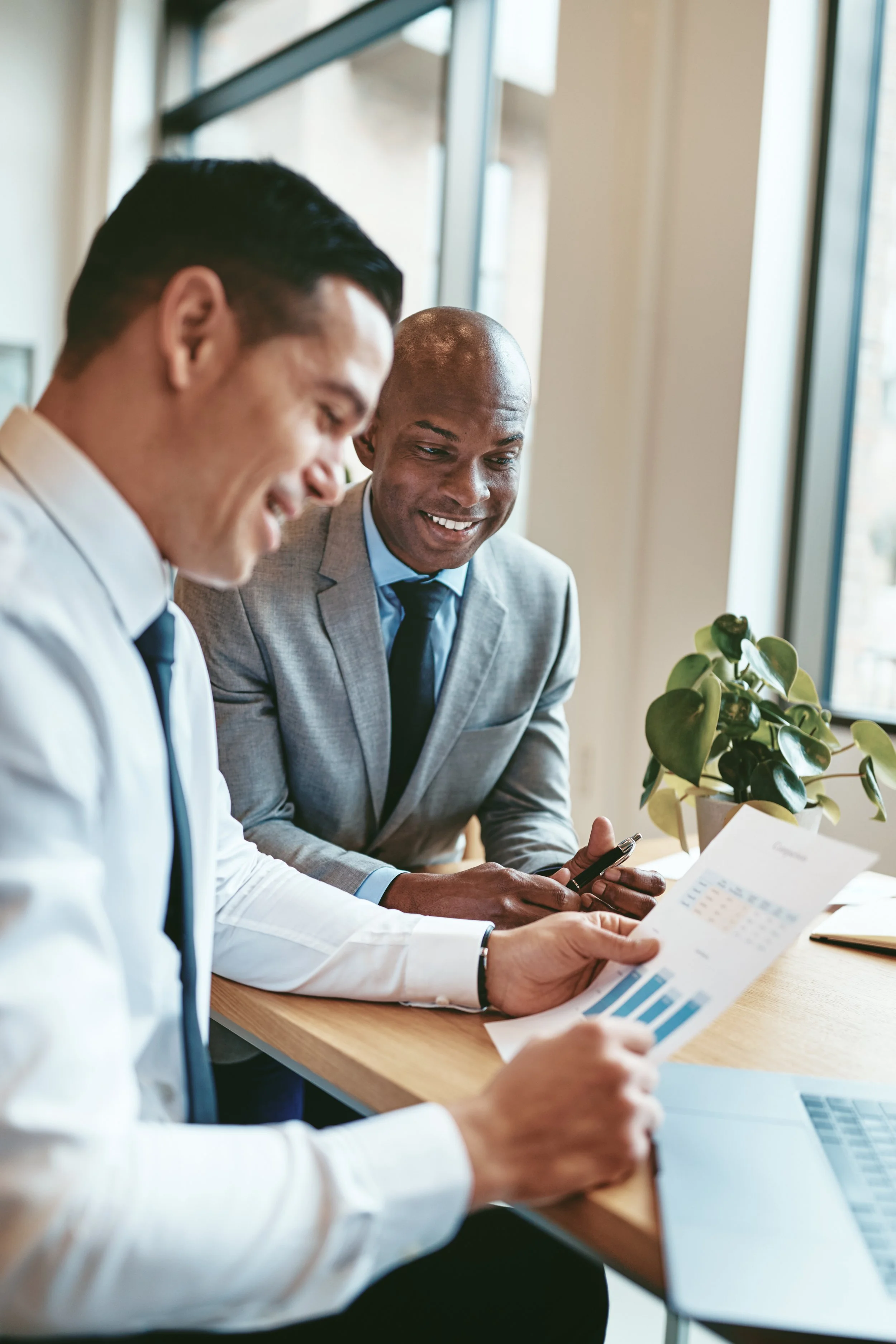 Professional advisors reviewing documents together, Experience of Time trusted by professionals who serve high-net-worth clients