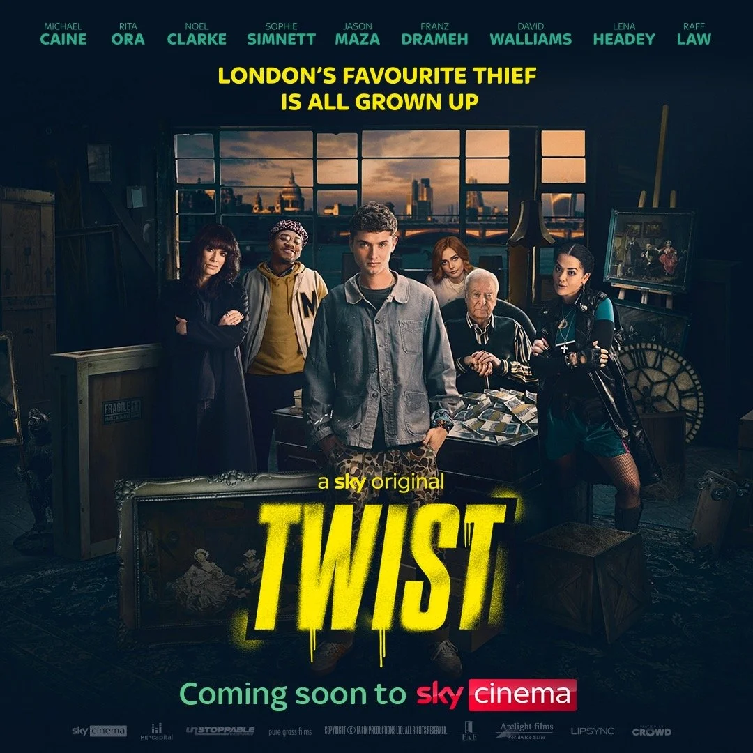 Promotional poster for the TV series 'Twist' featuring six main characters standing in an artistic room with large windows and a cityscape backdrop, including a young man in the center and various art supplies and paintings around.