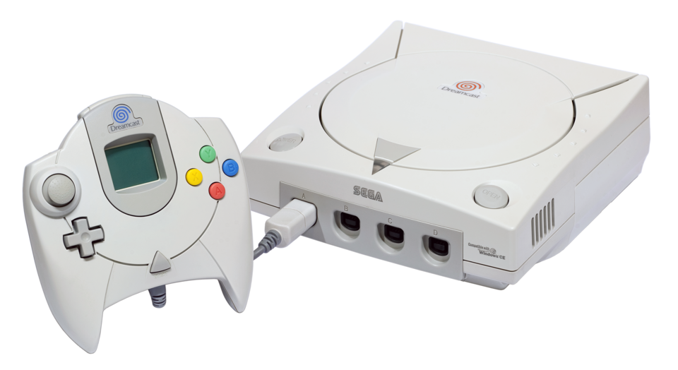 Sega Dreamcast game console with controller, white color, connected via cable.