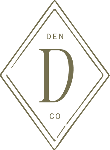 Logo with a large letter 'D' in the center, surrounded by a diamond outline, with the words 'DEN' above and 'CO' below.