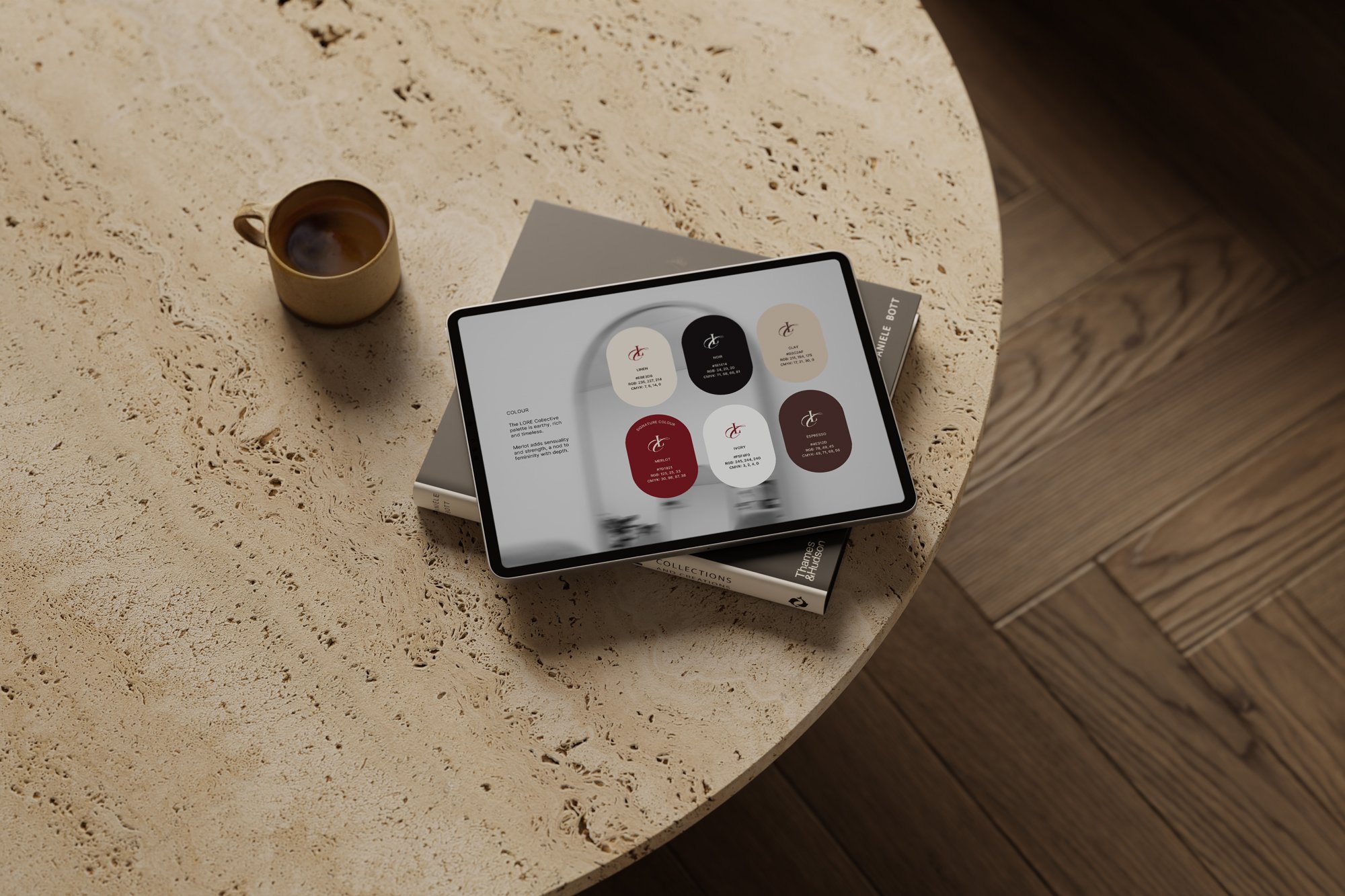 A beige textured table with a small beige cup of coffee, a magazine underneath, and a tablet displaying color and style options.