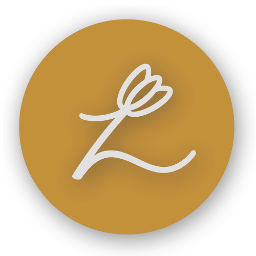 A circular logo with a gold background, black border, and a white line drawing of a flower or plant with leaves.