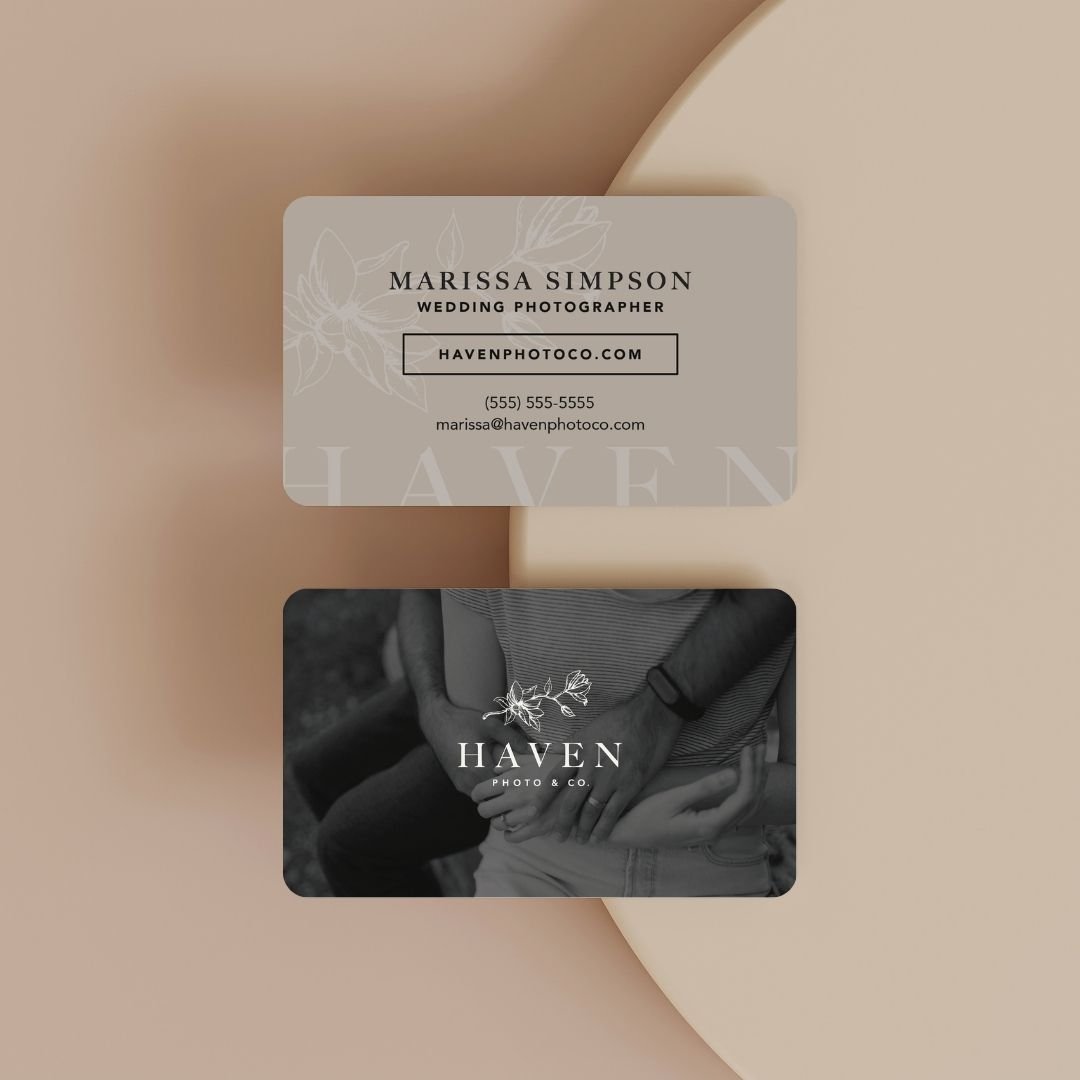 Business cards for Marissa Simpson, a wedding photographer, and Haven Photo & Co., set on a beige background.