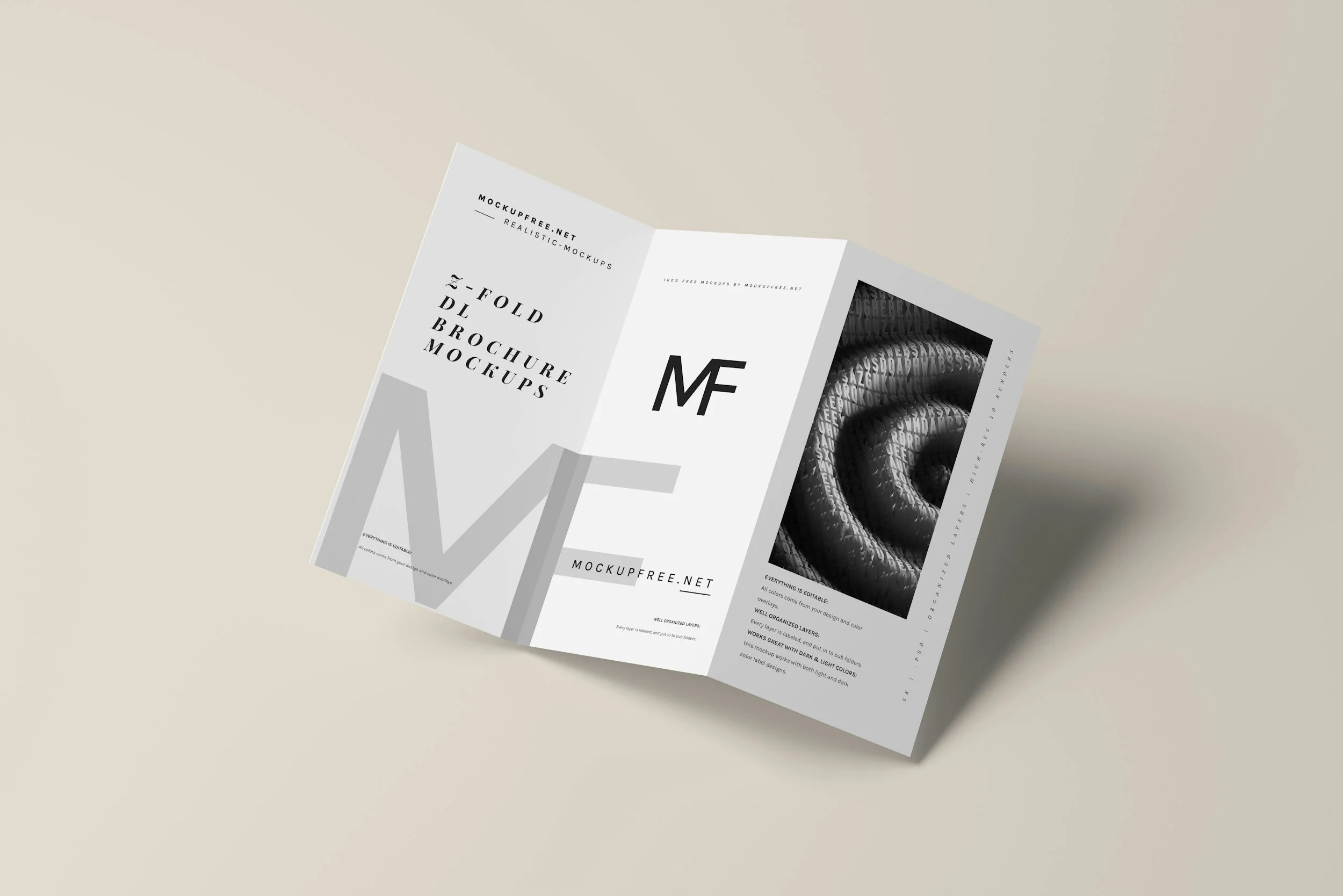 An open tri-fold brochure on a light-colored surface, displaying mockup designs with black and white abstract and text content.