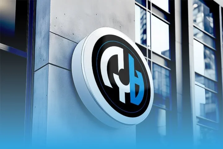 Modern building exterior with a large, circular logo featuring the letters T and H in black, white, and blue, mounted on the wall