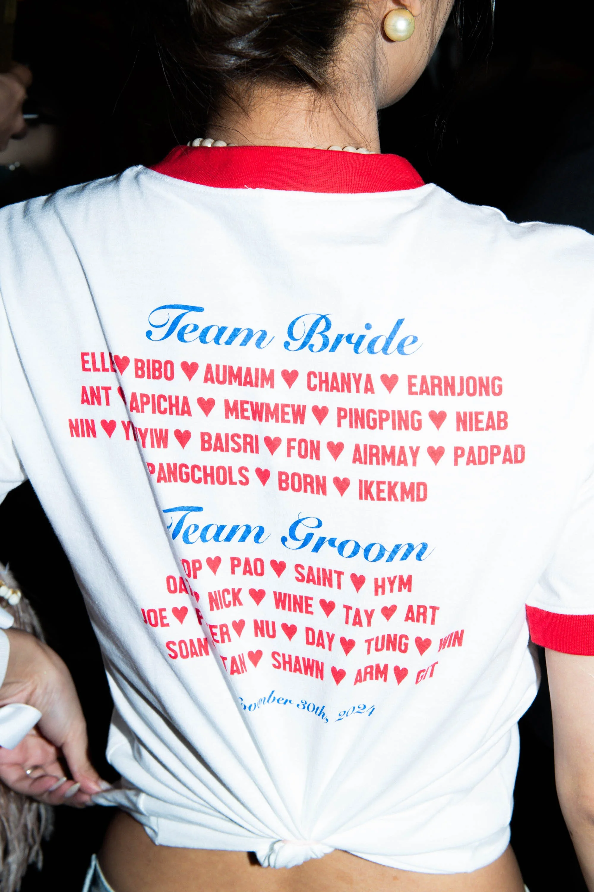 Detail of matching Team Bride and Team Groom shirts.
