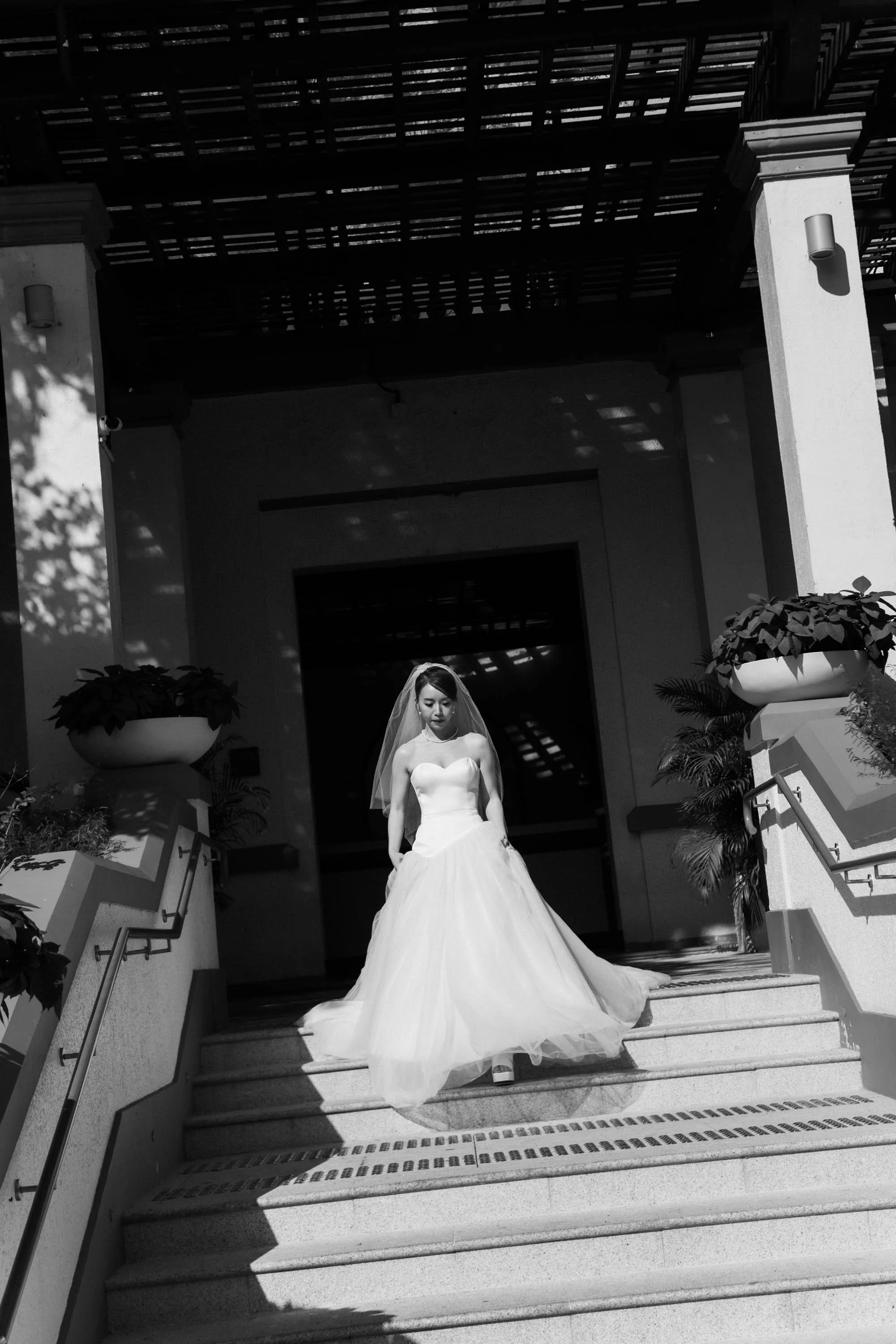 Bride walking toward the ceremony entrance.