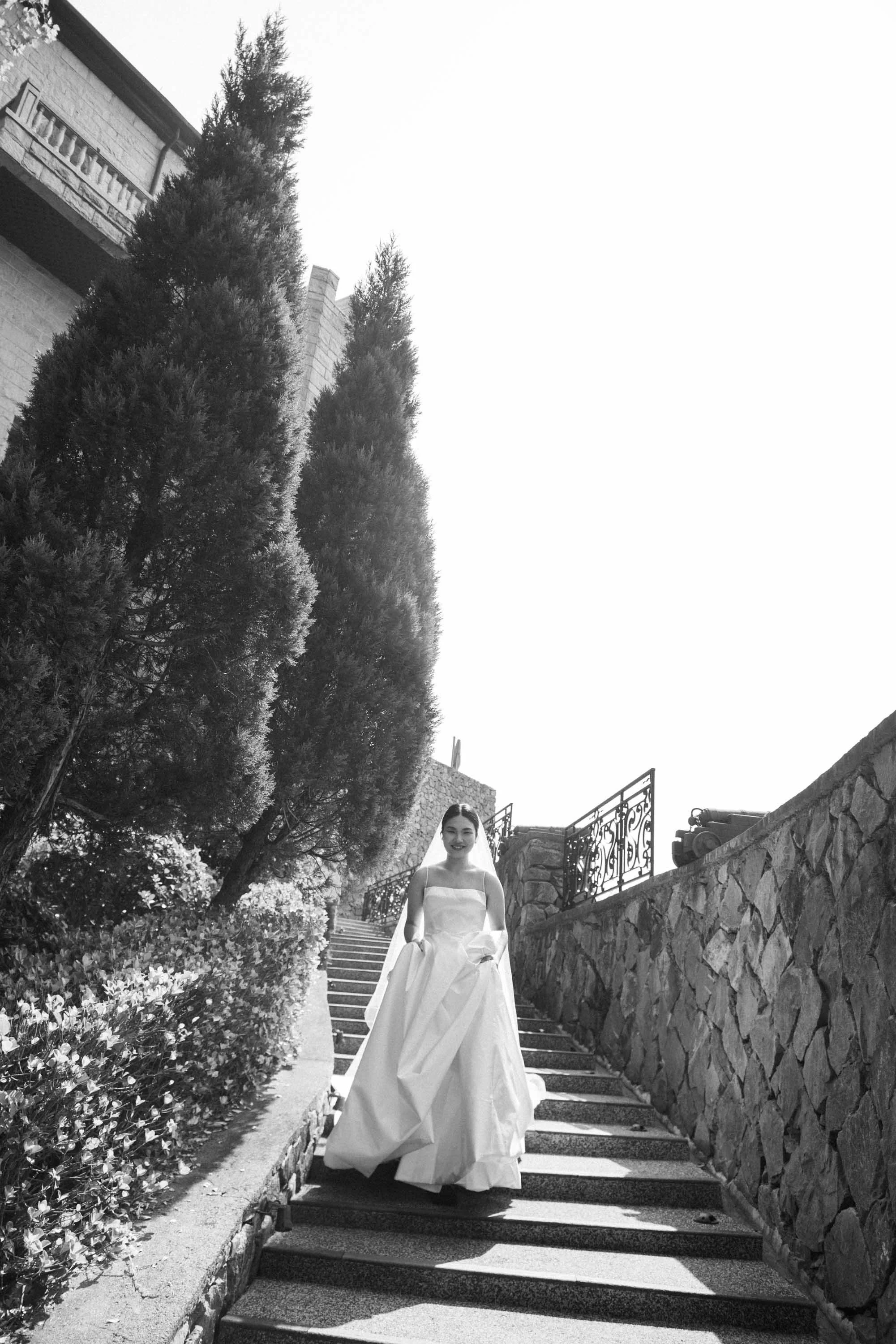 Bride walking down from the castle before the ceremony.