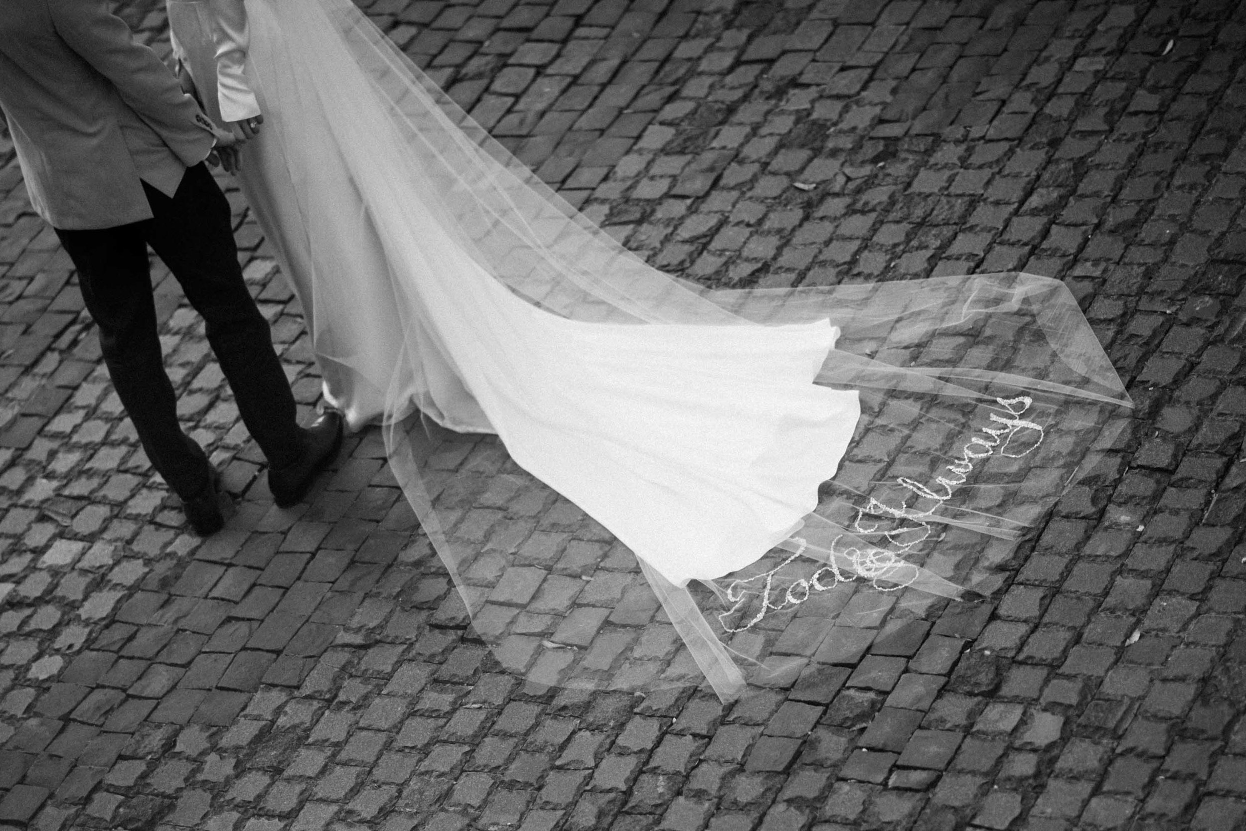 Bride and groom holding hands during their wedding vows.