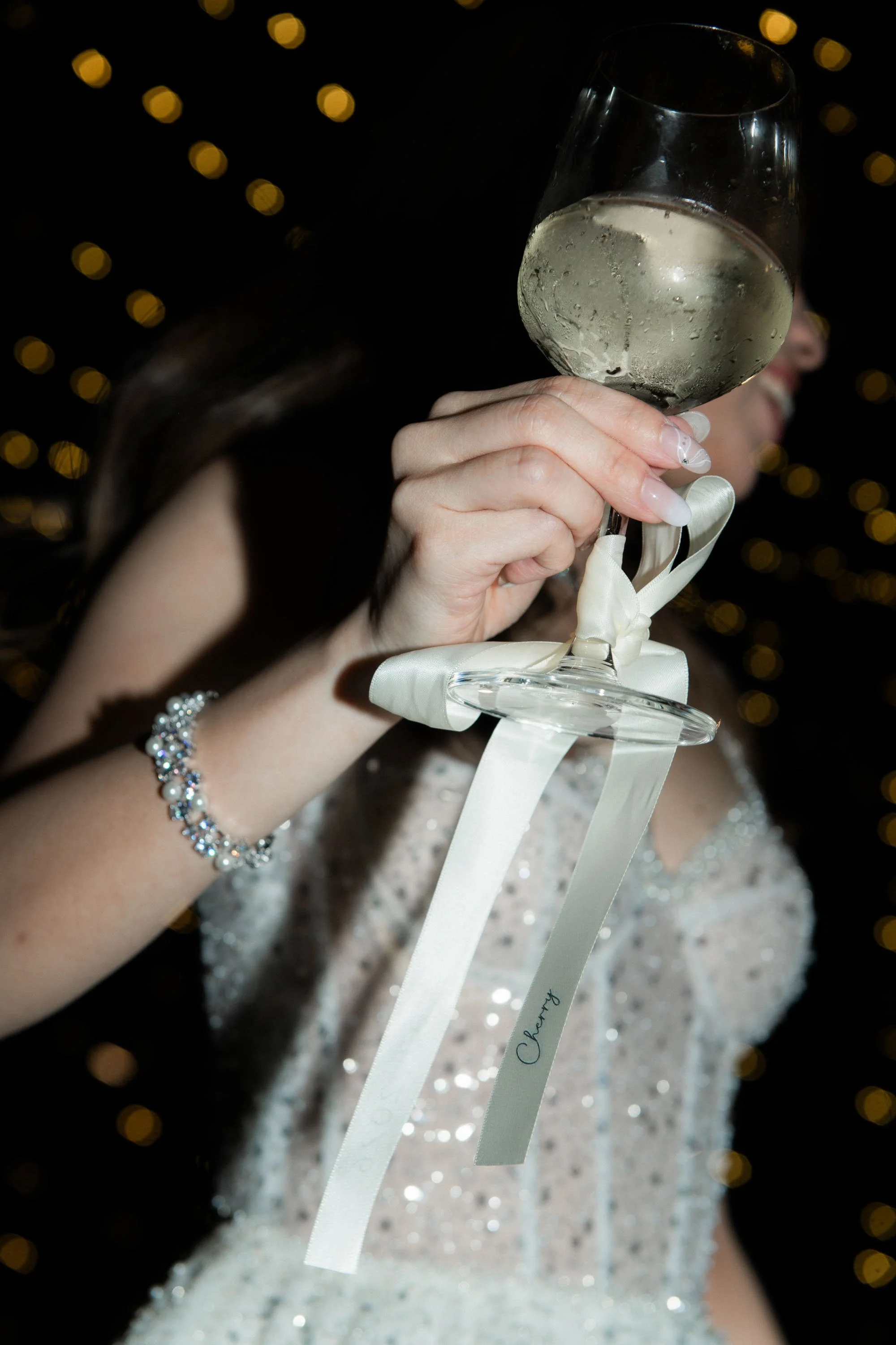 Bride holding a champagne glass during the reception.