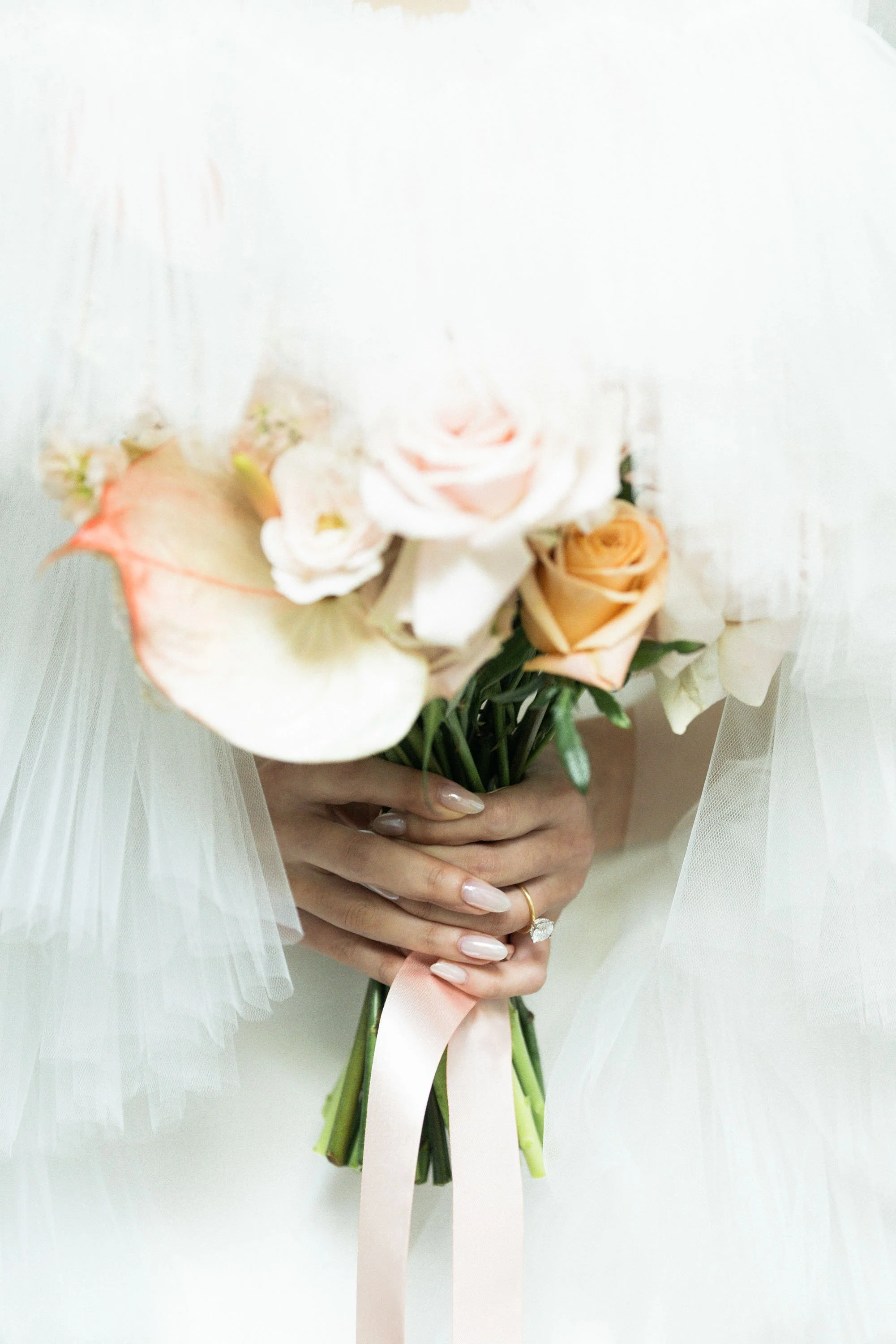 Bride holding her wedding bouquet before the ceremony.