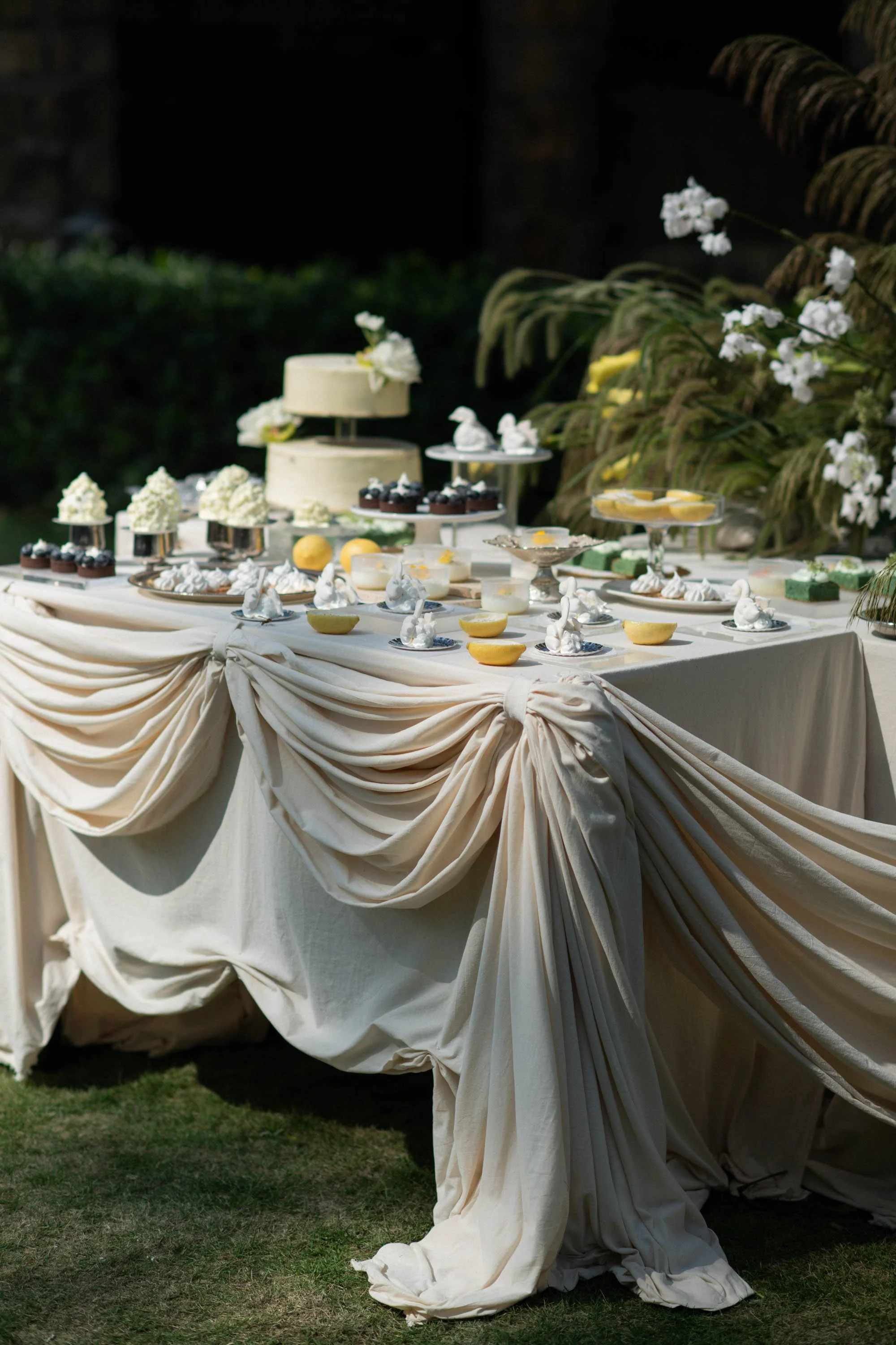 Dessert table decorated with cakes and sweets for the wedding.