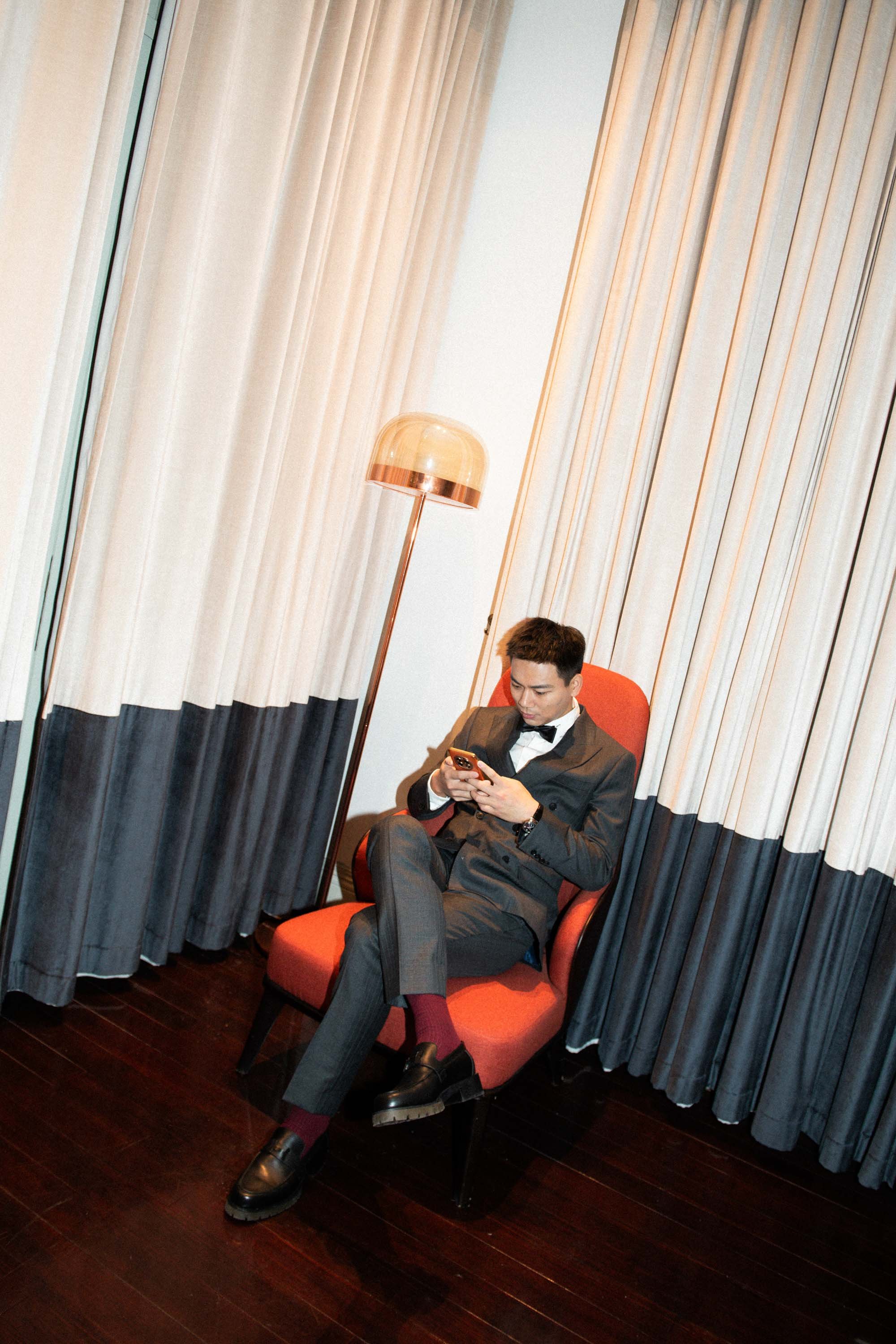 Groom sitting in the lounge before the reception.