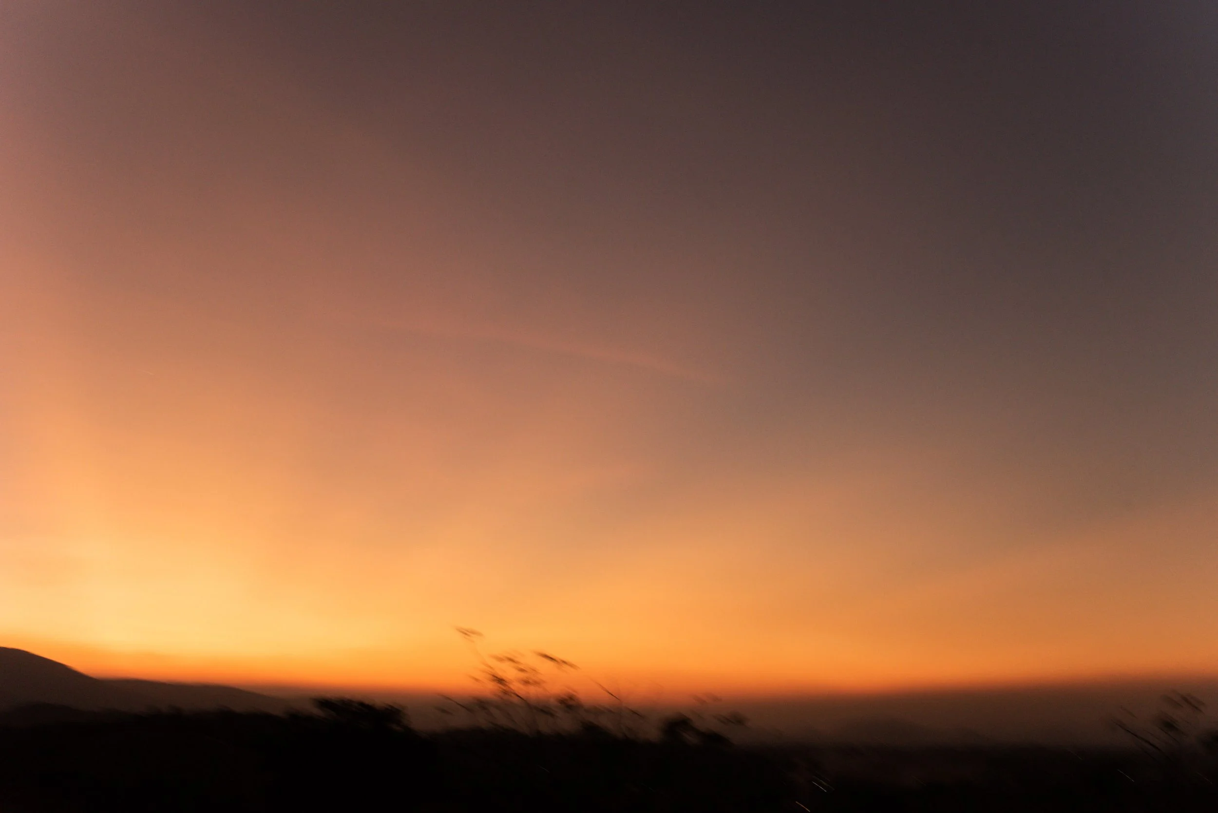 Orange sunset fading across the evening sky over Khao Yai.