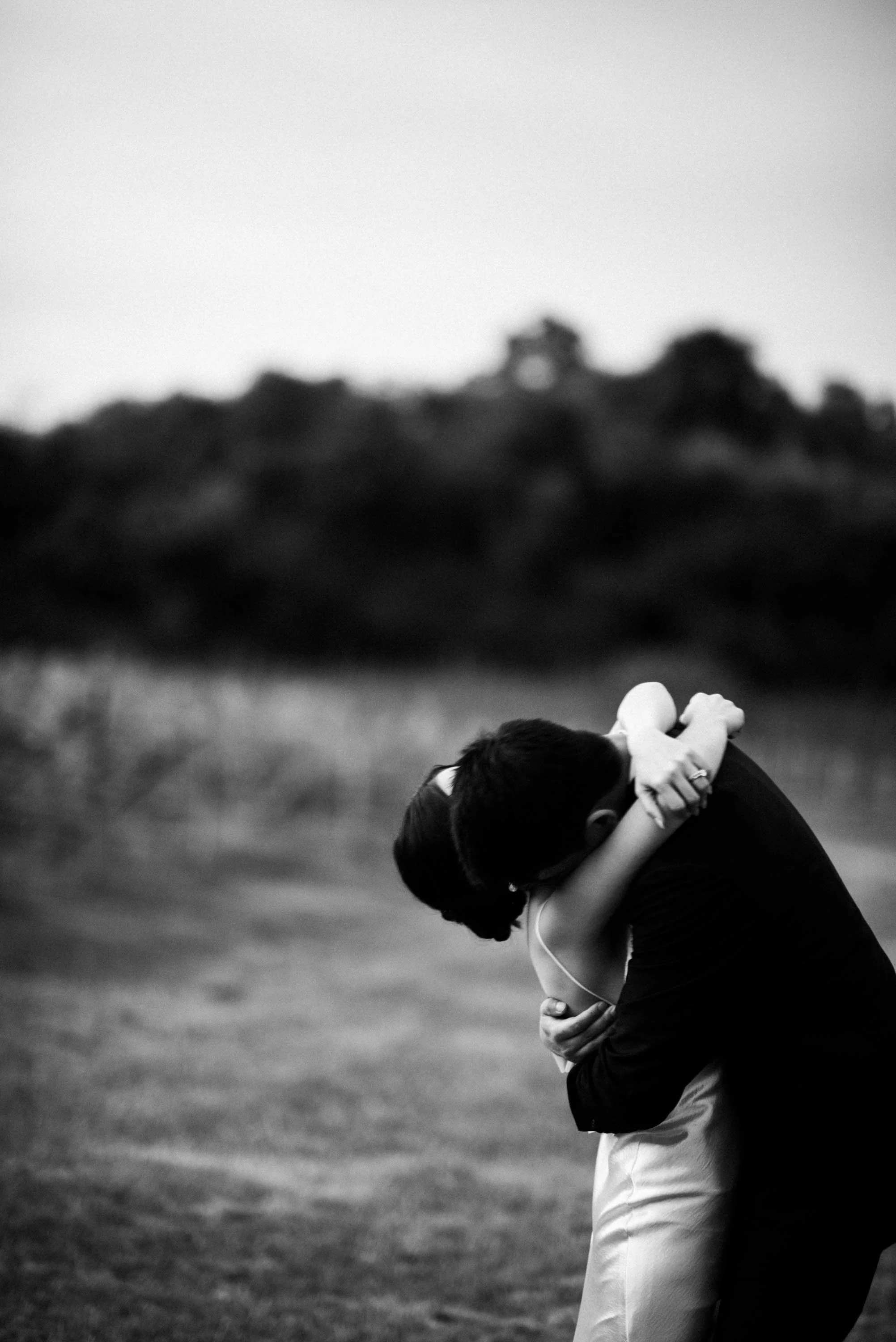 Bride and groom embracing during their wedding celebration.