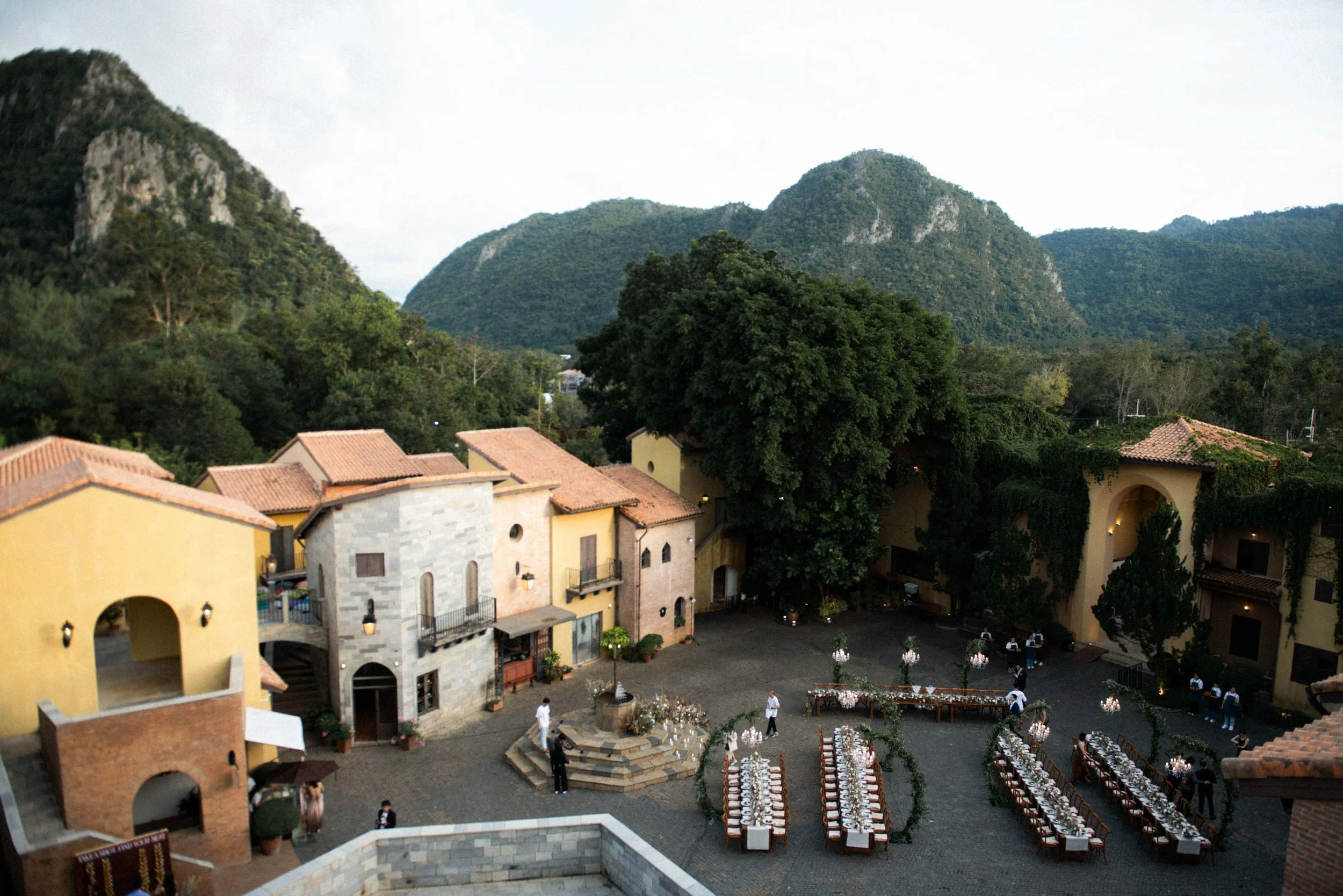 Aerial view of Primo Piazza surrounded by mountains and the wedding setting.
