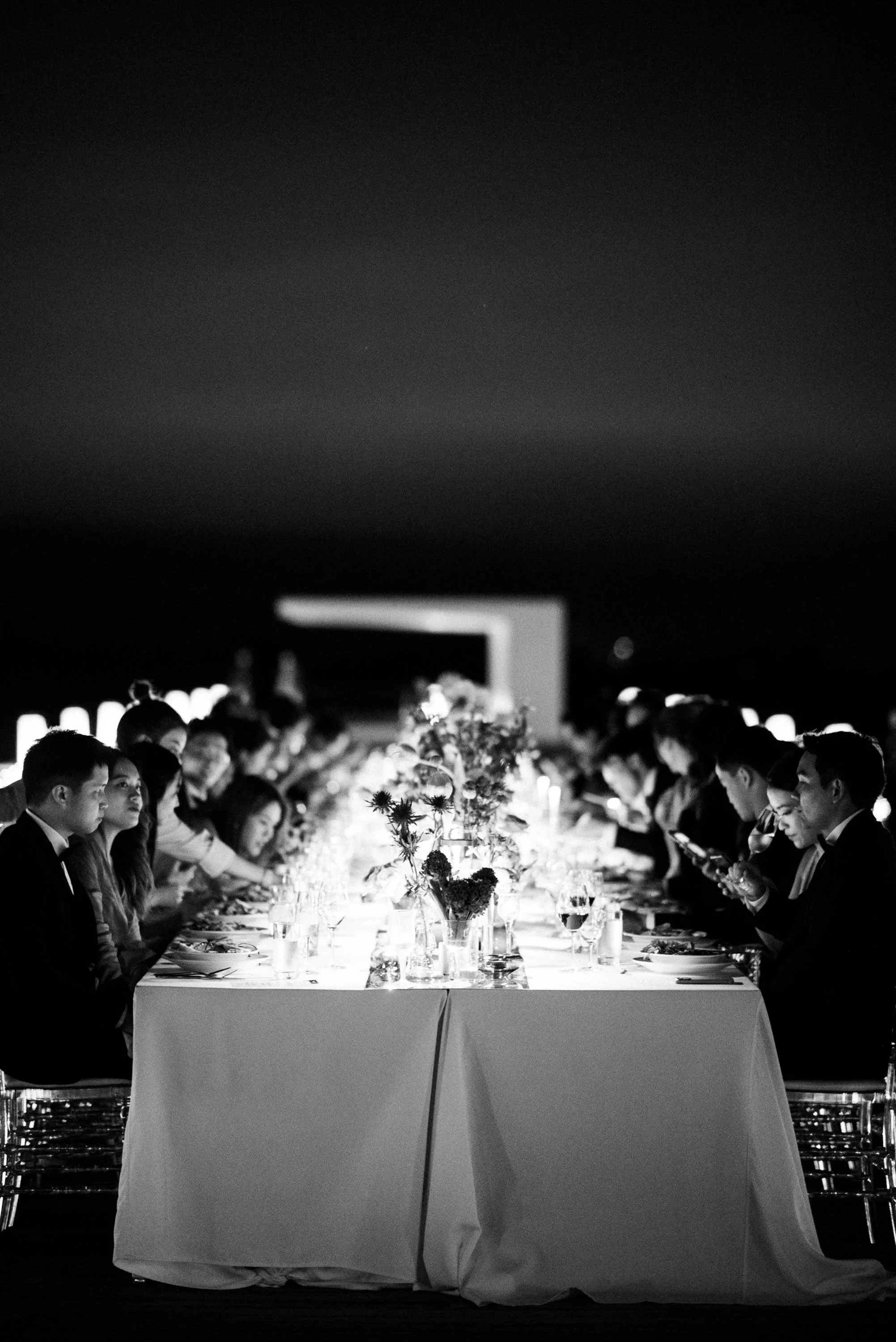 Guests gathered around a long table for dinner at the private Khao Yai celebration.