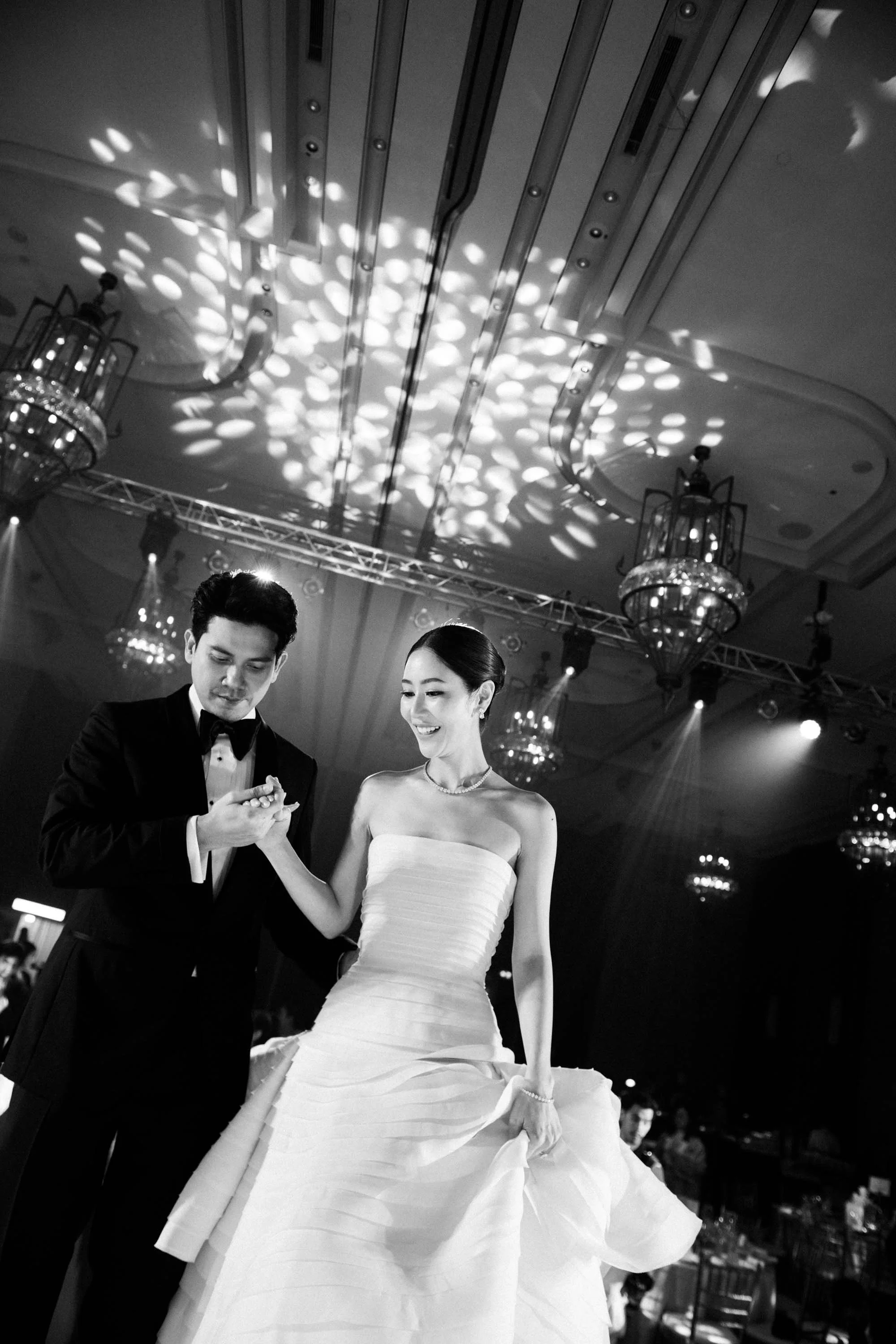 Bride and groom rehearsing their entrance into the reception.
