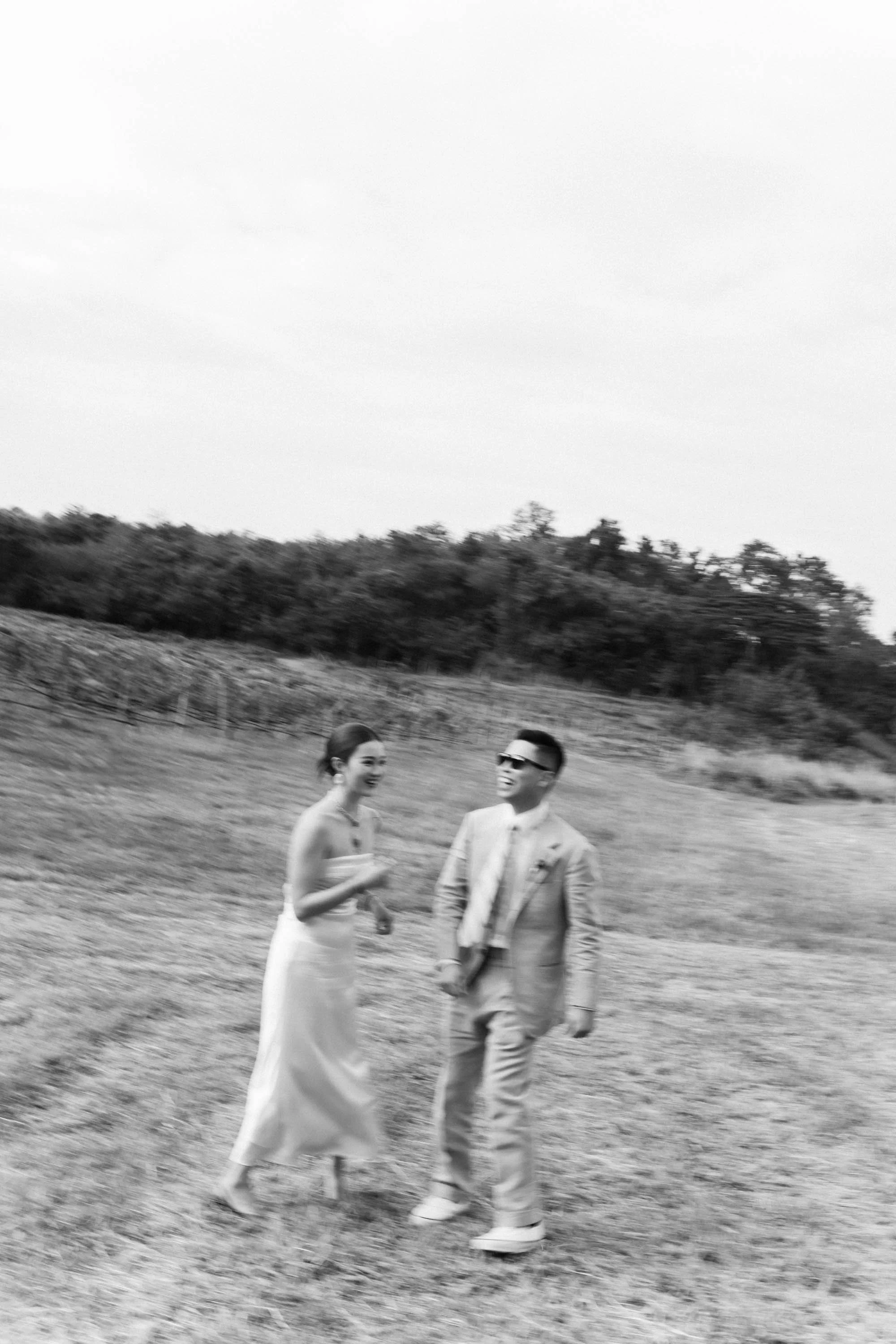 Bride and groom sharing a playful moment during their portrait session.
