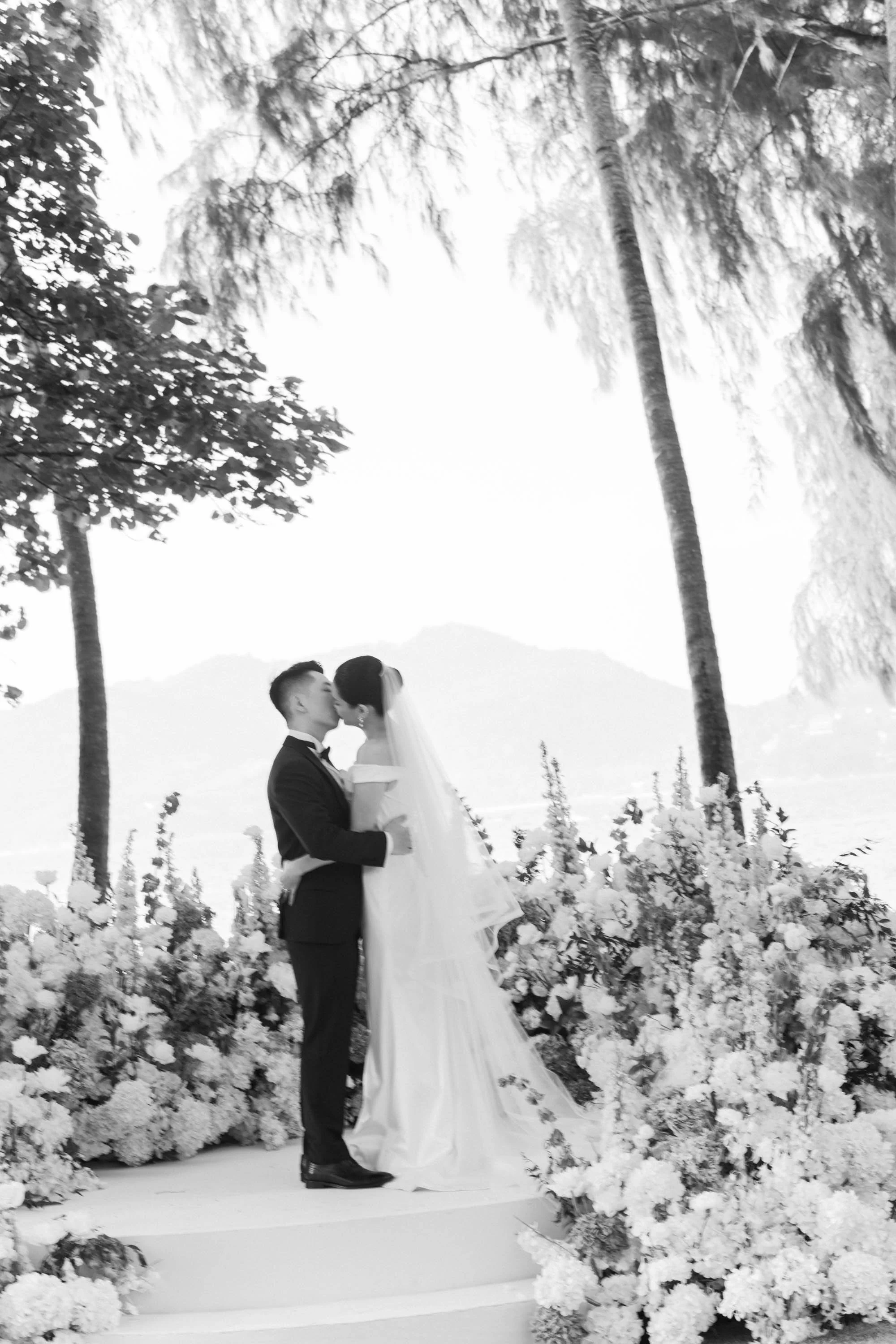 Bride and groom sharing a kiss after the wedding vows.