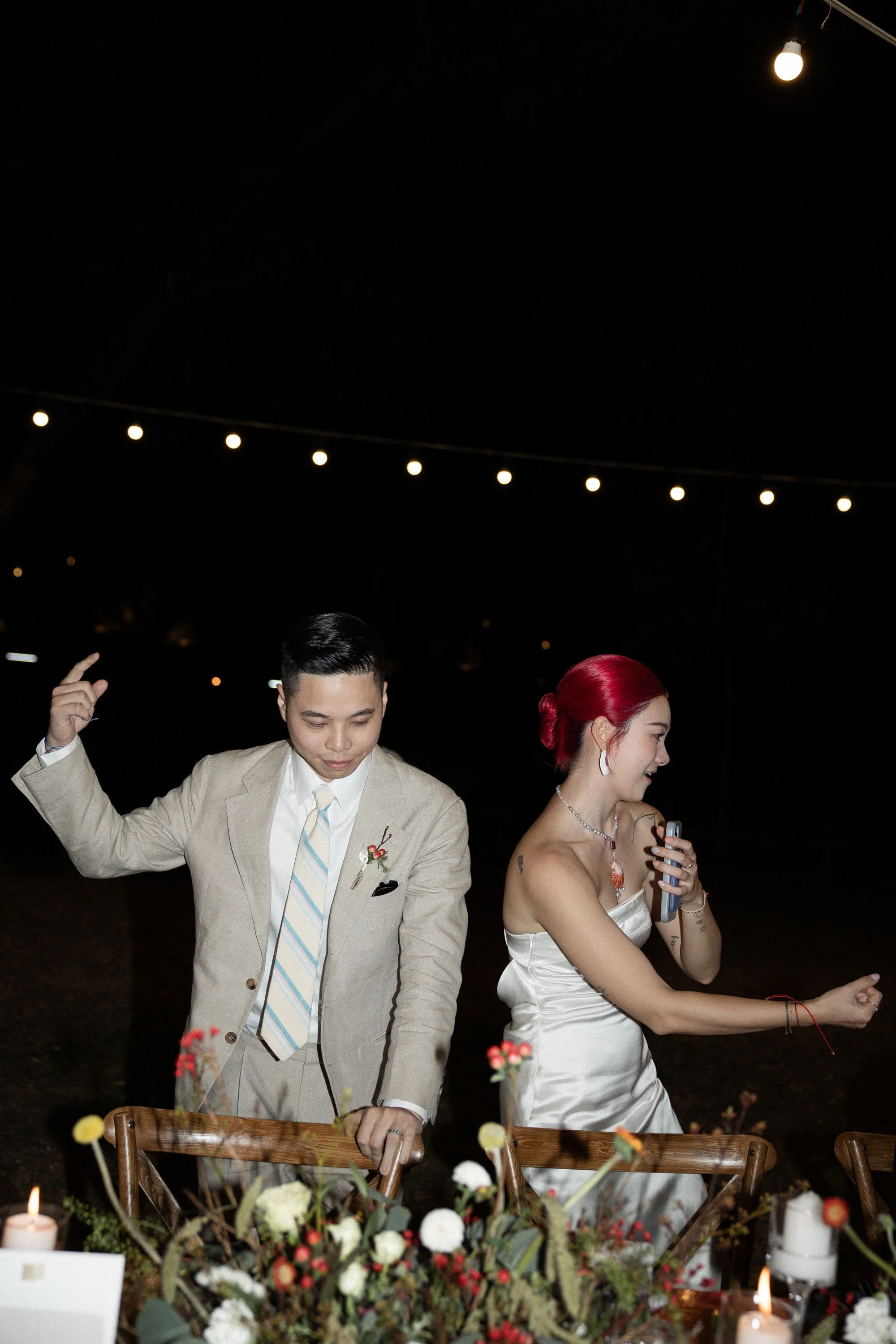 Bride and groom enjoying the evening celebration together.