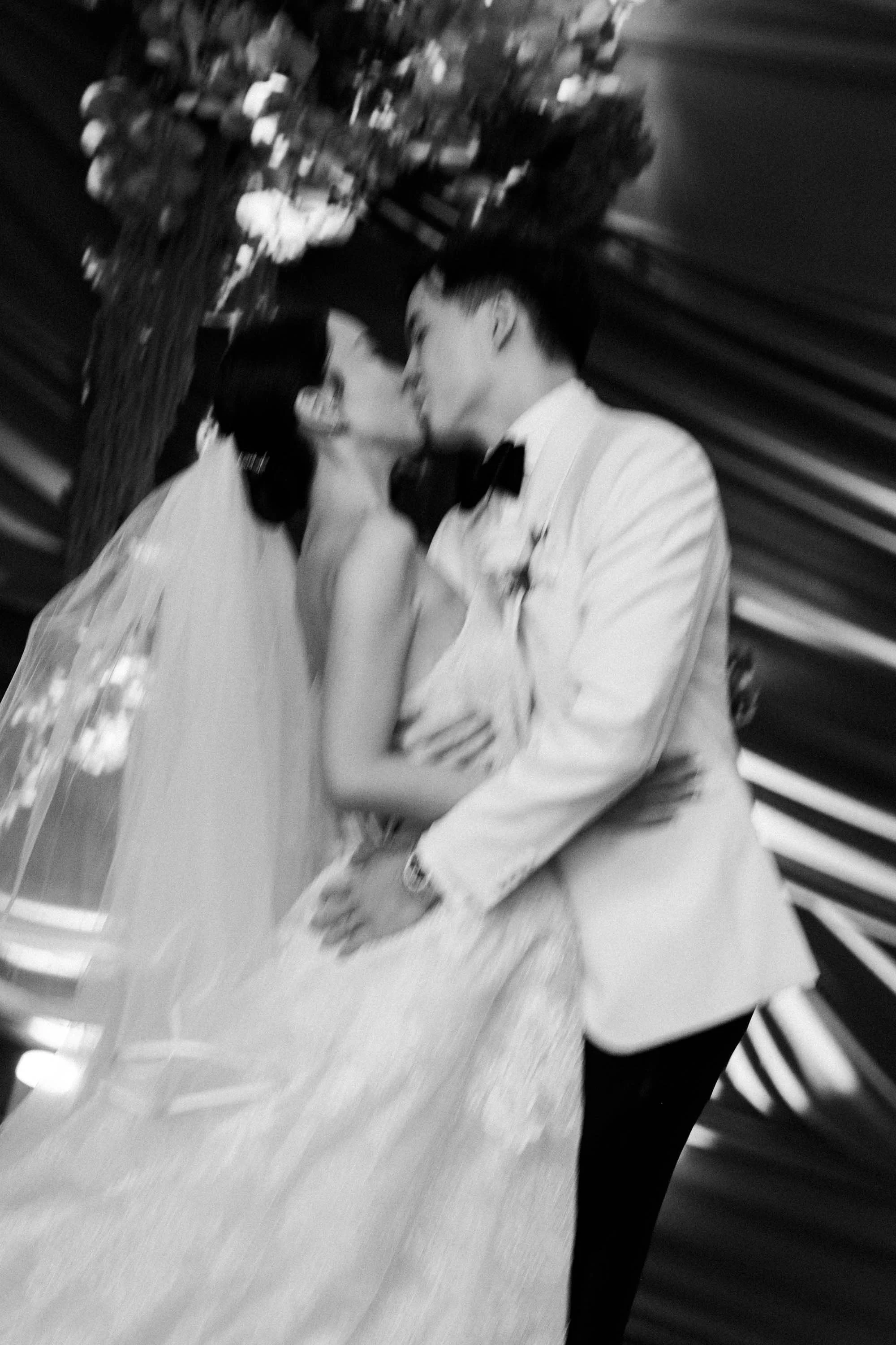 Bride and groom sharing a kiss after the wedding vows.