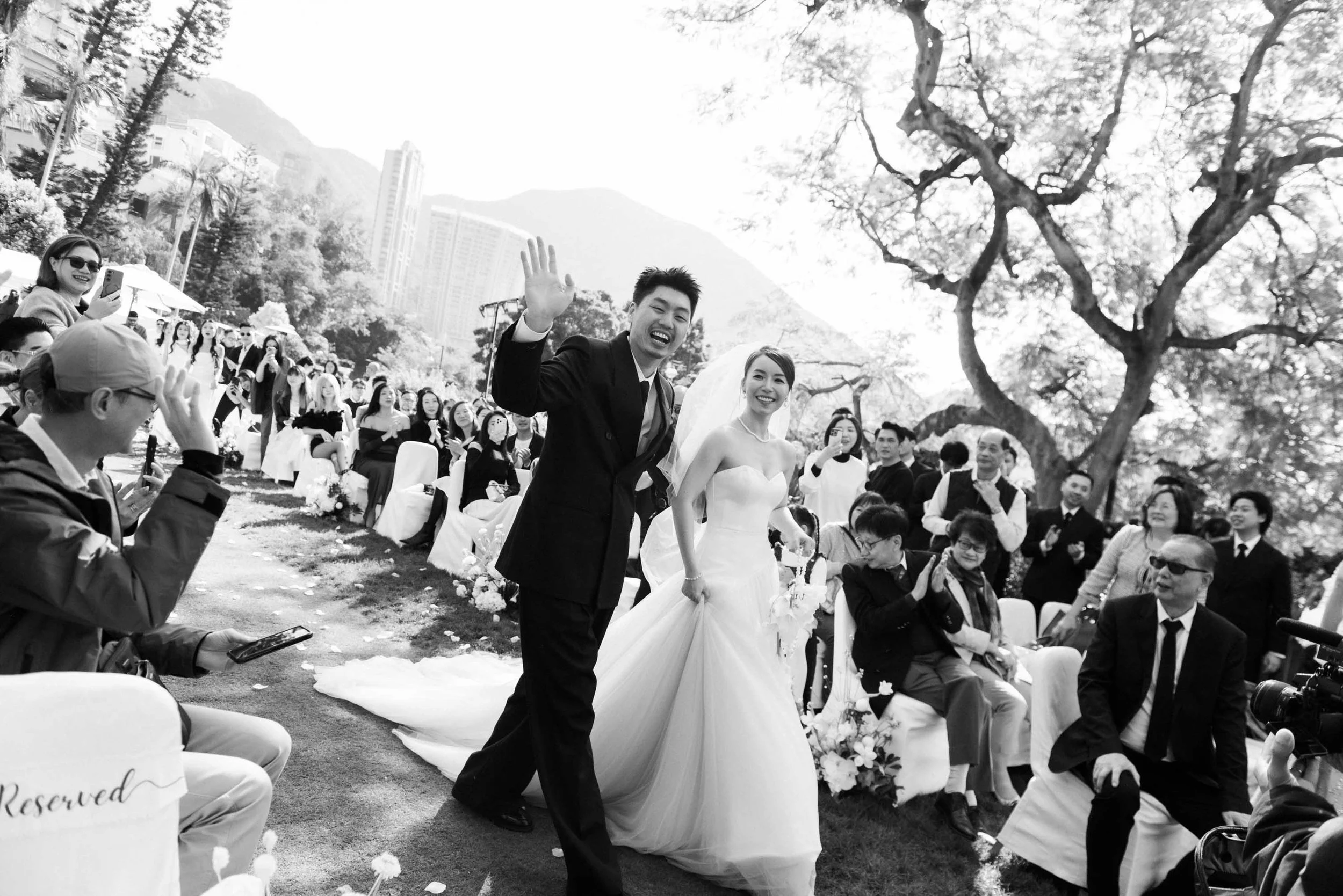 Bride and groom celebrating with guests after the ceremony.
