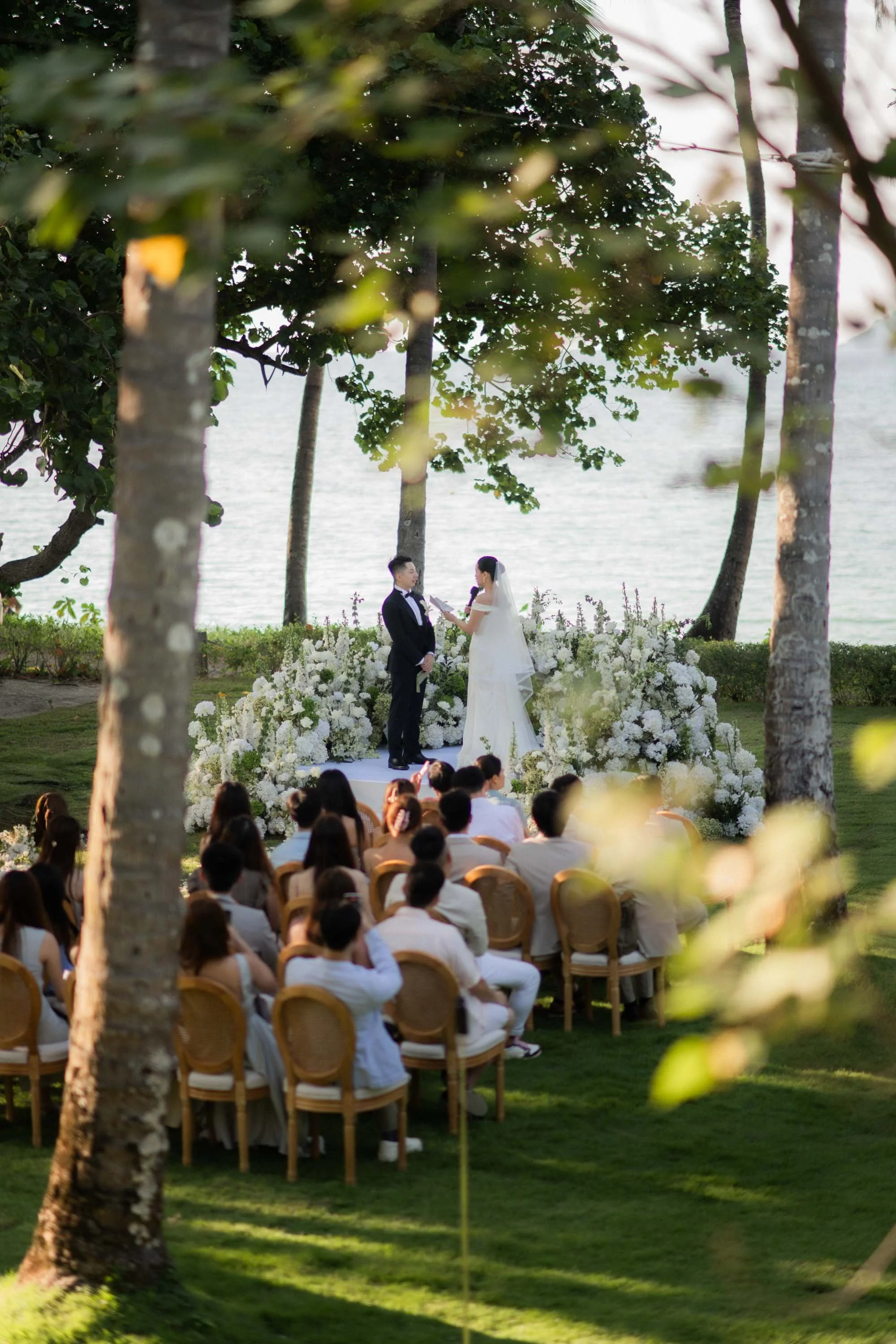 Outdoor wedding ceremony overlooking the ocean at Rosewood Phuket.
