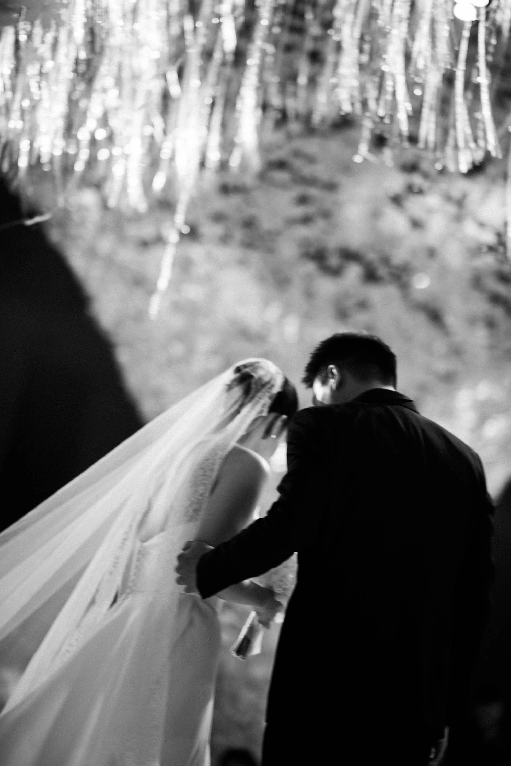 Groom holding the bride before the reception.