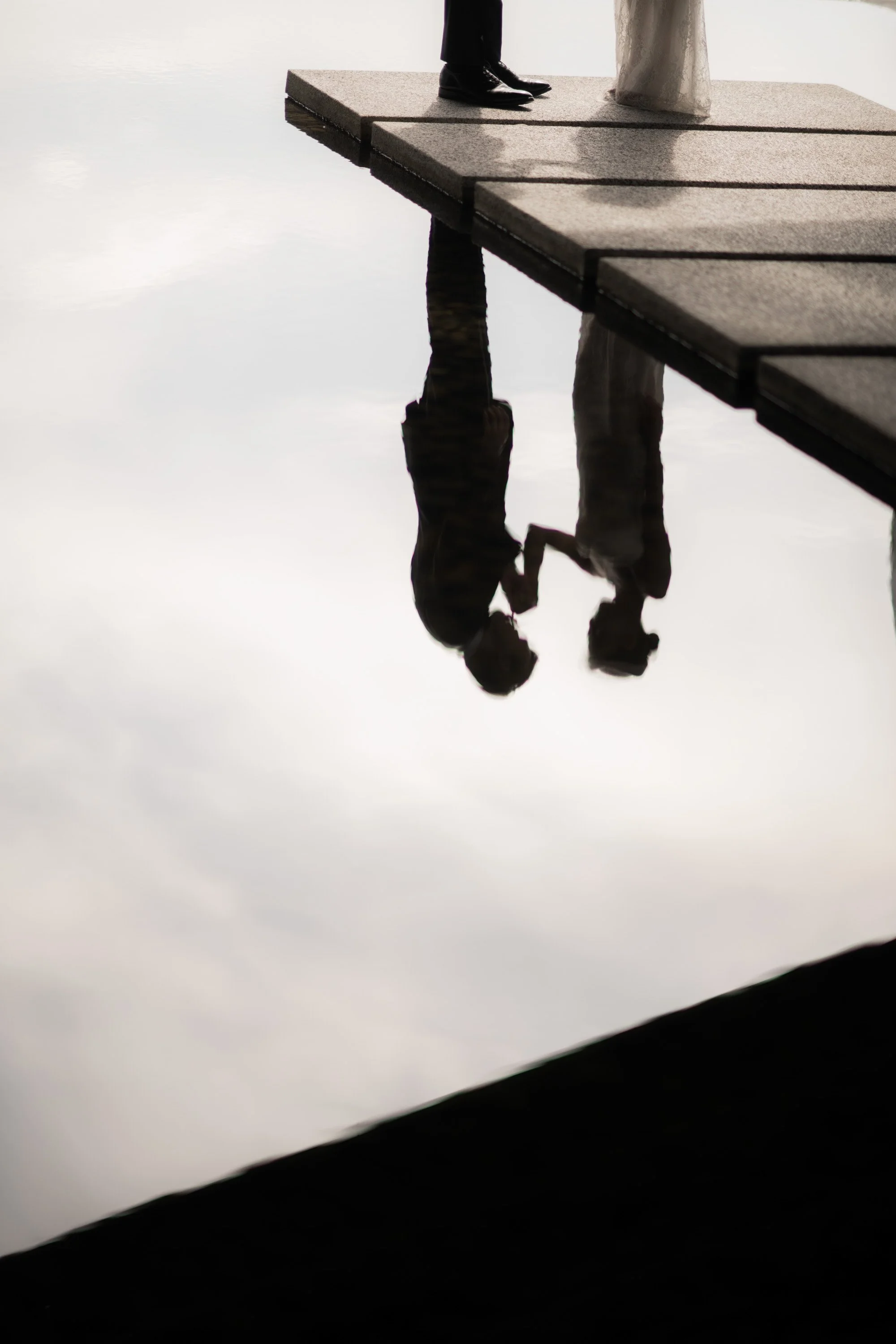 Reflection of the bride and groom during their portrait session.